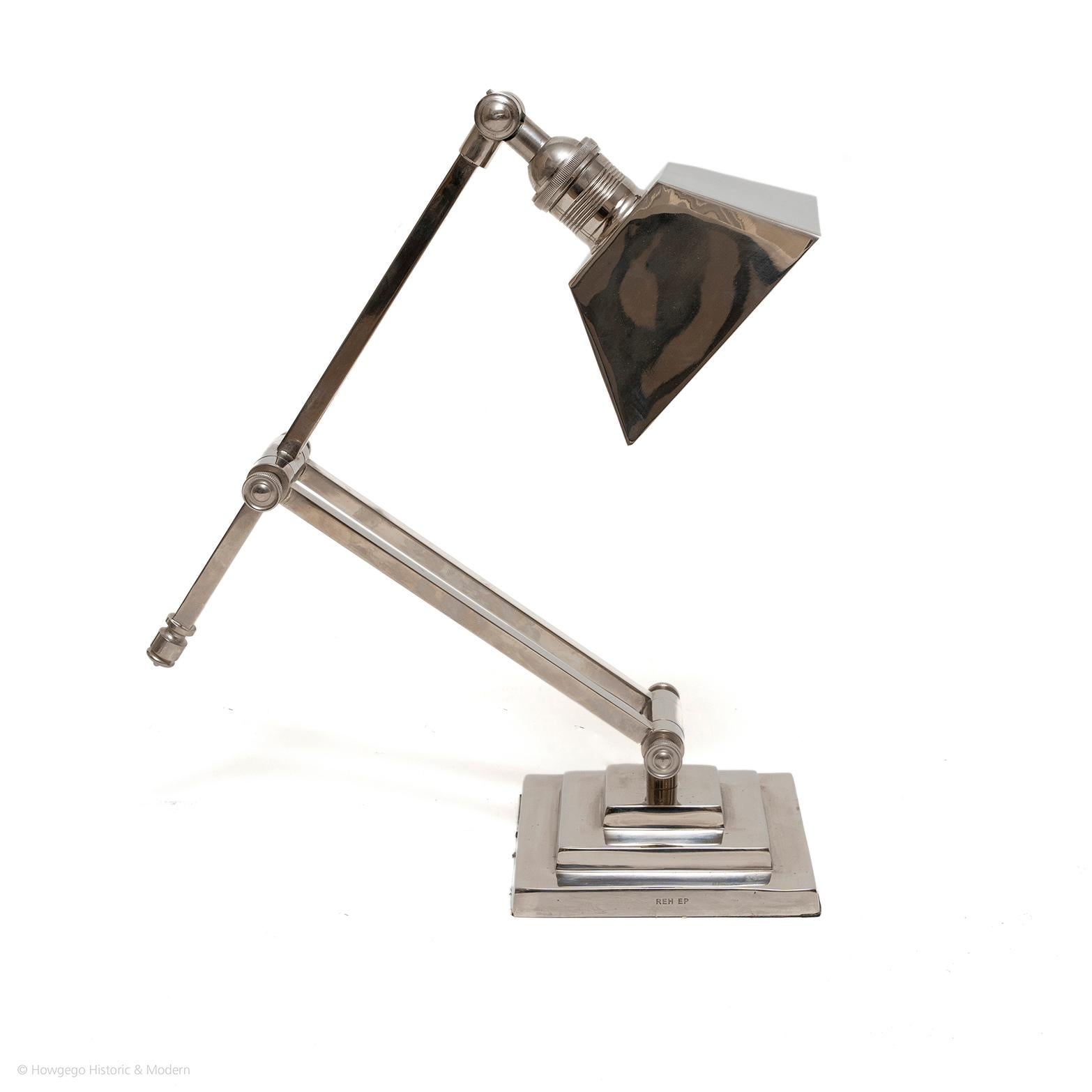 Classic Art Deco design 
Ergonomic with adjustable shade, long swivel arm and support all with screws to fix into position
On a square stepped plinth base, engraved REH EP

The plinth 7.5cm., 3