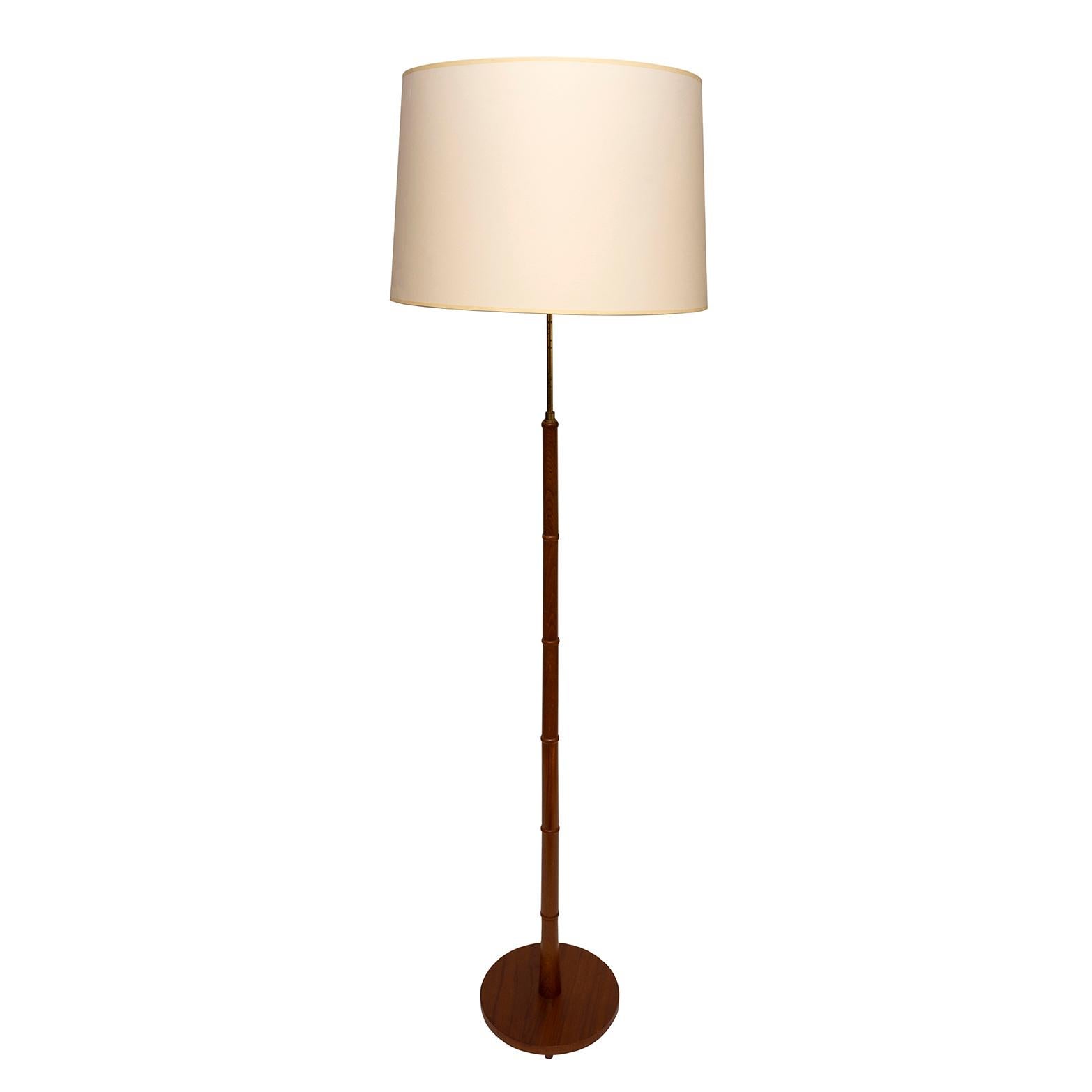 A FINE, MID-CENTURY MODERN, FRENCH, BROWN SUEDE & BRASS, FLOOR STANDING LAMP WITH ORIGINAL PARCHMENT & SUEDE SHADE, 161 cm., 5ft 3 ½ “ high

Evokes the mid-century modern atmosphere. 
The fretwork patterning at the bottom of the shade softens and