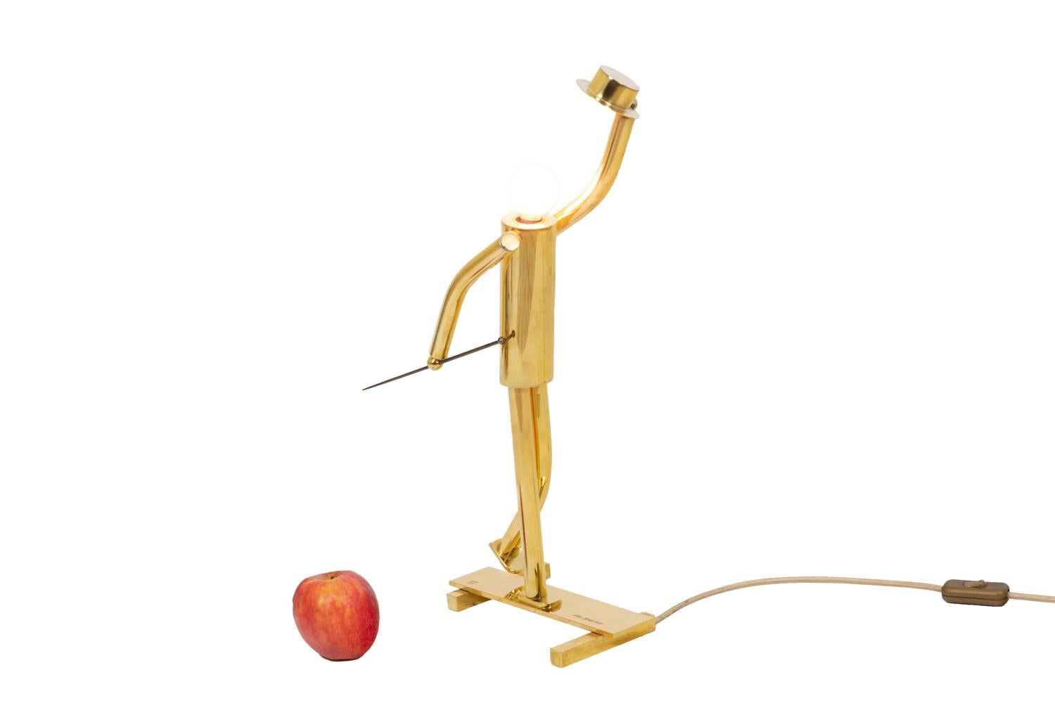 Lamp in gilt bronze representing a music hall dancer with tap shoes holding a hat and a cane in his hand. The bulb takes the place of the character’s head.

Engraved “New York 1930” on the base and stamped.

American work realized in the 1930’s.