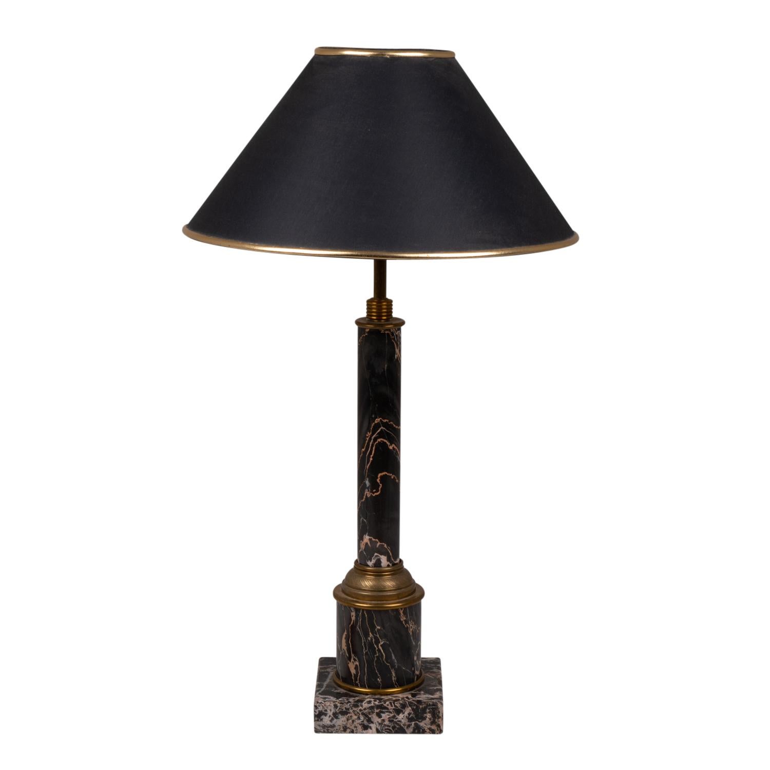 Lamp style Empire in marble and gilded bronze, representing a column in the Antique style, in black portor gold color. Original lampshade in black cotton, with its golden piping.

French work realized circa 1950.

New and functional electrical