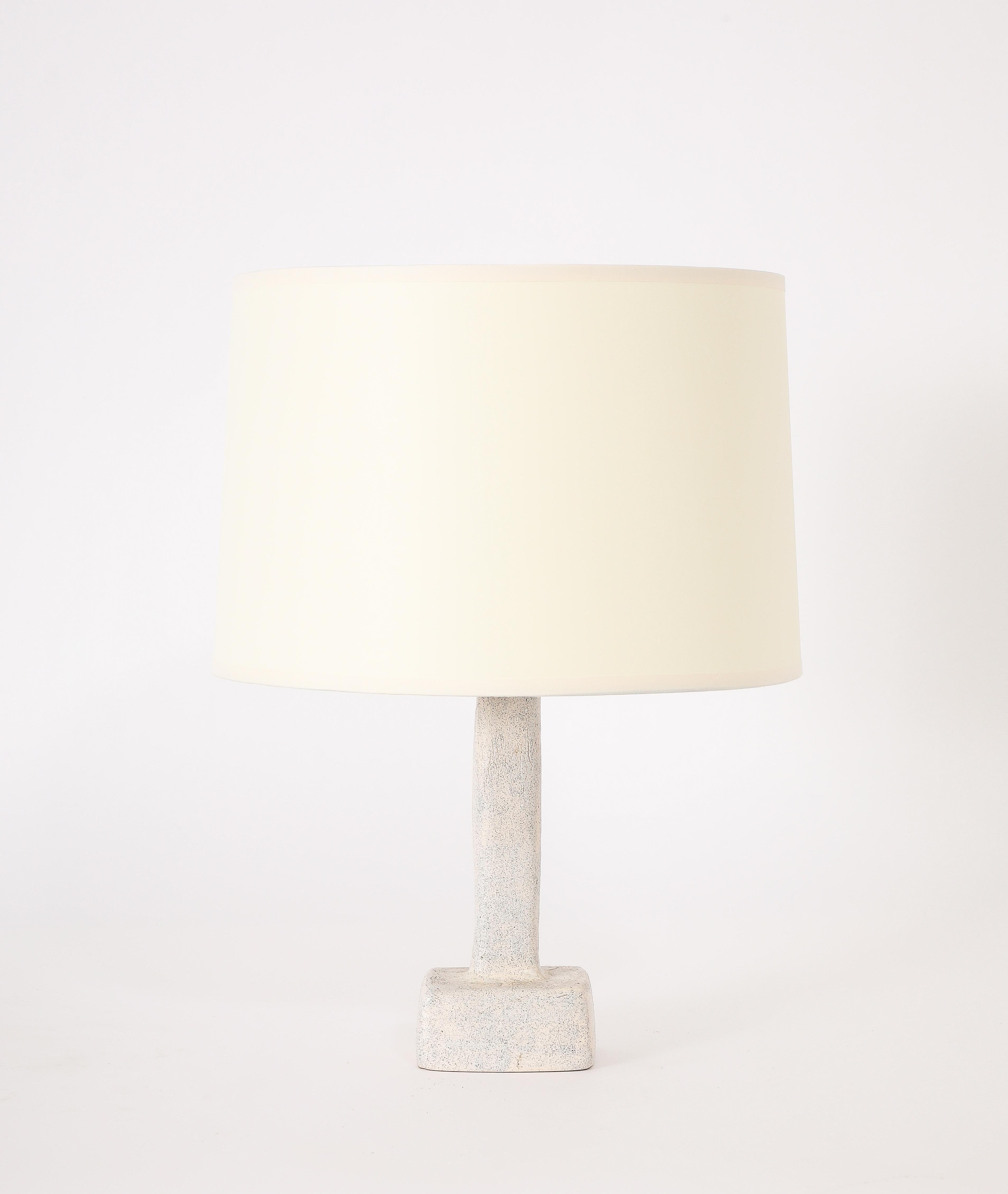 Ceramic table lamp with a simple square stem ending in a rectangular base.

France 1950s

Base Only 10x3x2