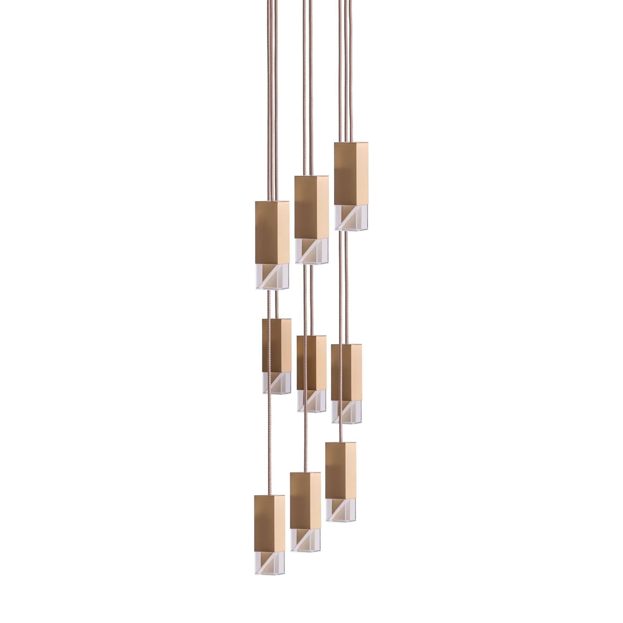 Lamp one 9-light chandelier in brass by Formaminima
Dimensions: H 111.9 x 30 x 30 cm
Materials: Lamp body in solid brass, Satin finish

Ultra-thin anti-reflection crystal diffuser
Inside-diffuser Limoges biscuit-finish porcelain sheets
Satin