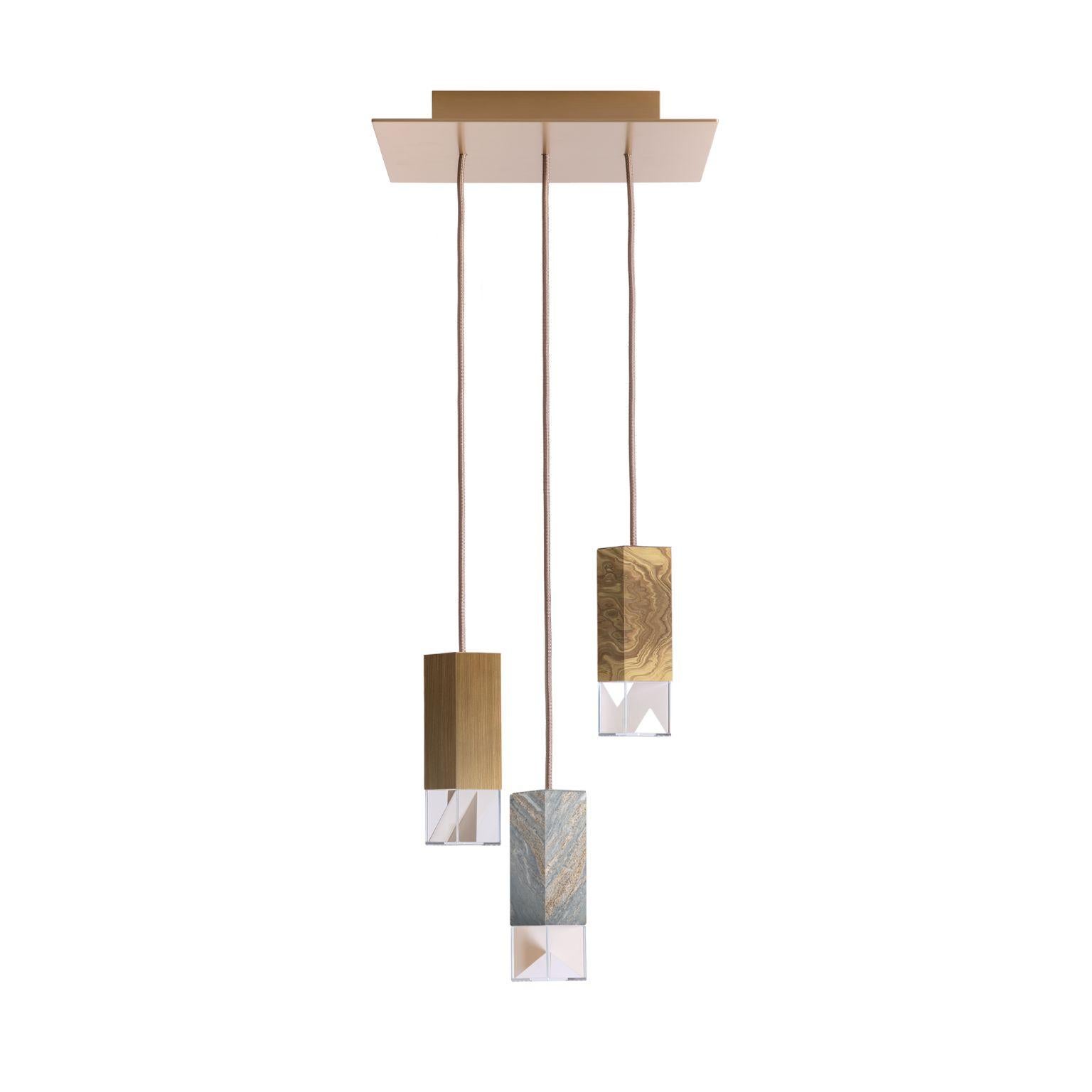 Lamp one Collection chandelier 01 by Formaminima
Dimensions: D 30 x W 30 x H 68 cm (adjustable height, please contact us.)
Materials: Body lamps: handcrafted solid Palissandro Blu Nuvolato, polished
finish; solid burnished brass matt satin