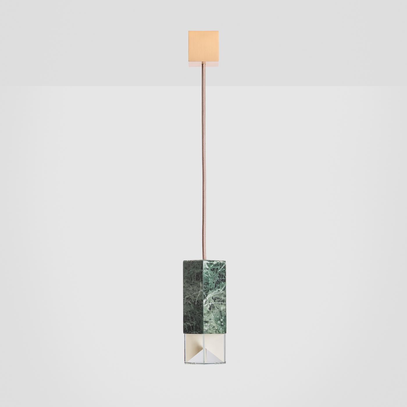 Featuring a dramatic contrast of prized materials, this limited-edition pendant lamp exudes a luxurious vibe. Part of the Colour Edition of exclusive lighting handcrafted of selected Italian marbles, this version showcases a superb shade of Green