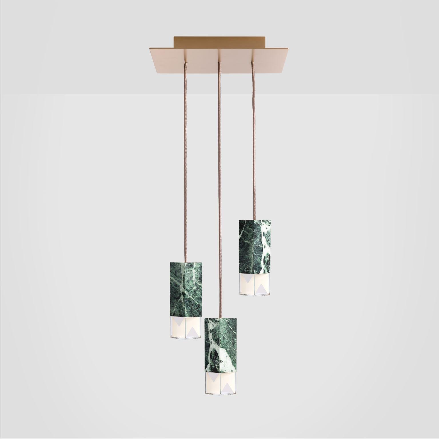 Lamp one green trio chandelier by Formaminima.
Dimensions: W 30 x D 30 x H 68 cm
Materials: 
Body lamps: handcrafted solid Green Alpes marble, translucent, polished finish, Crystal diffusers, Limoges biscuit-finish
porcelain sheets, Ceiling rose
