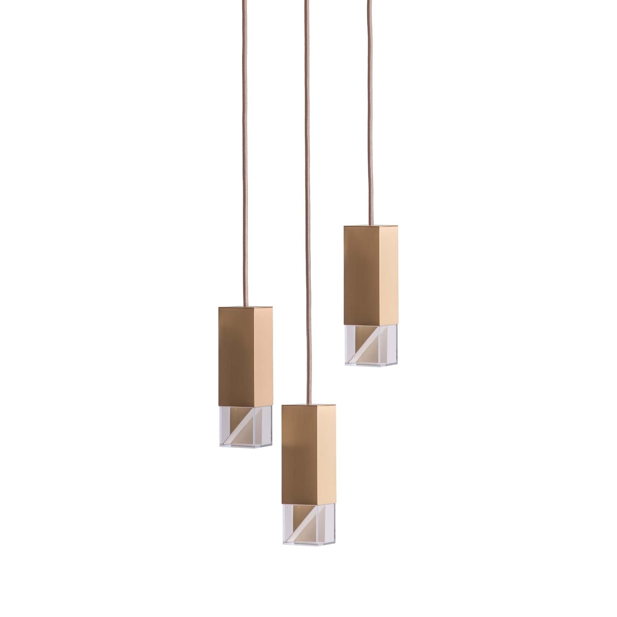 Lamp one trio chandelier in brass by Formaminima
Dimensions: 30 x 30 x H 68 cm
Materials: Lamp body in brass

Ultra- thin anti-reflection crystal diffuser
Inside- diffuser Limoges biscuit-finish porcelain sheets
Satin brass ceiling rose H 5 x