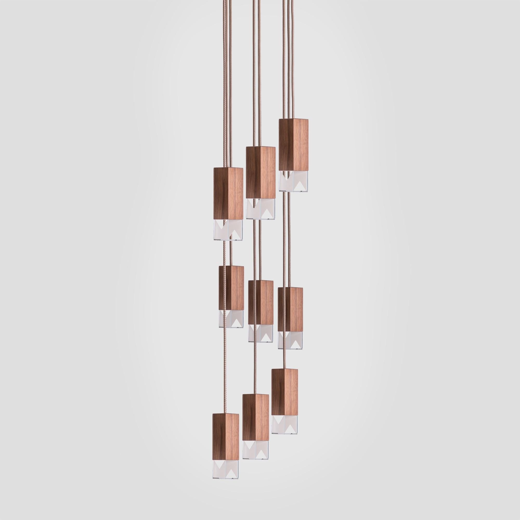 Combining the pure simplicity of a modern silhouette with the glamour of a stately piece, this superb chandelier will add an architectural element in a large living or dining room decor. Suspended from a square ceiling plate (30x30cm) of