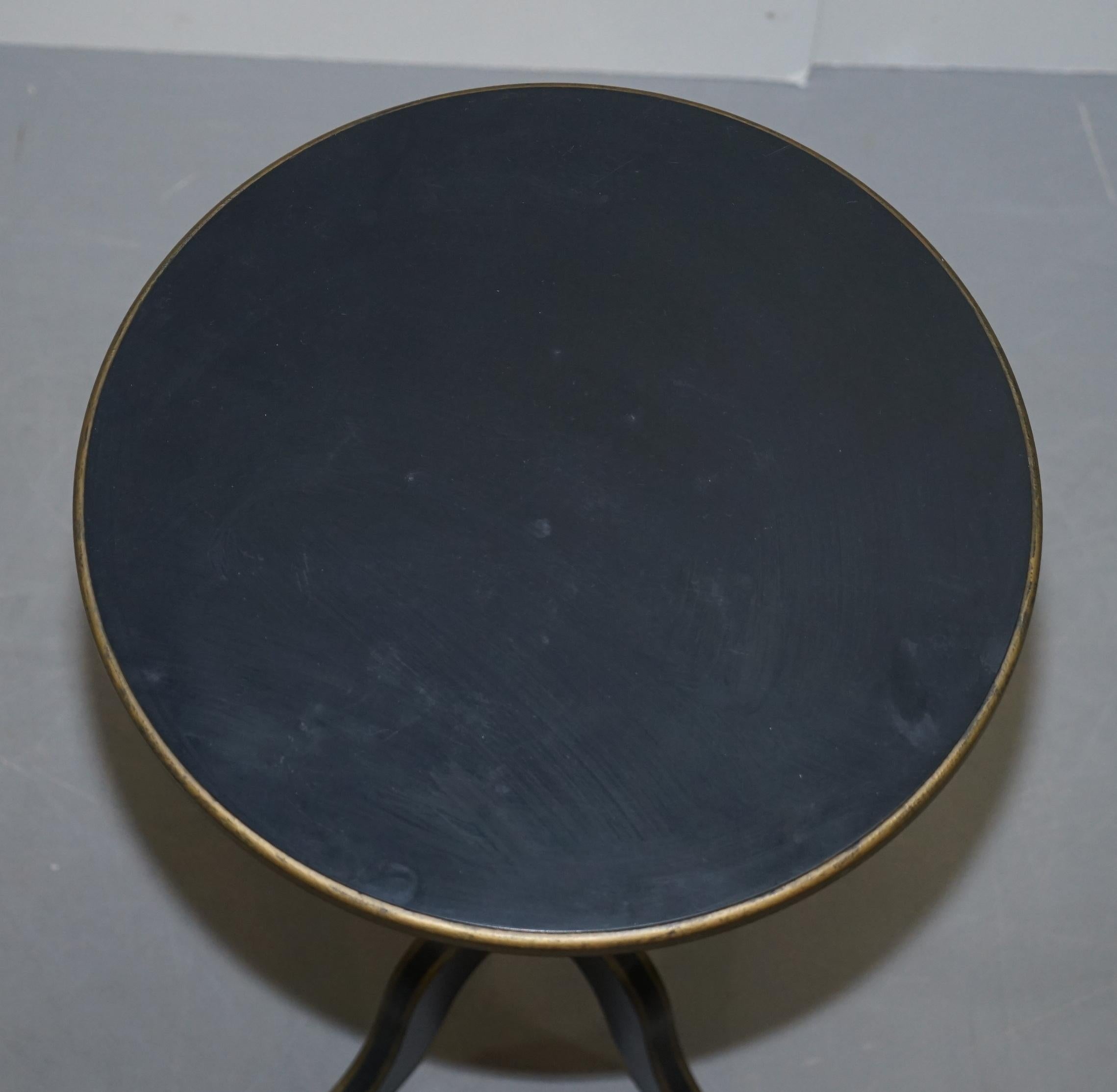 We are delighted to offer for sale this nice antique style ebonized side table with gold gilt detailing and tripod base

I have a matching pair of these listed under my other items which are slightly smaller

We have cleaned waxed and polished