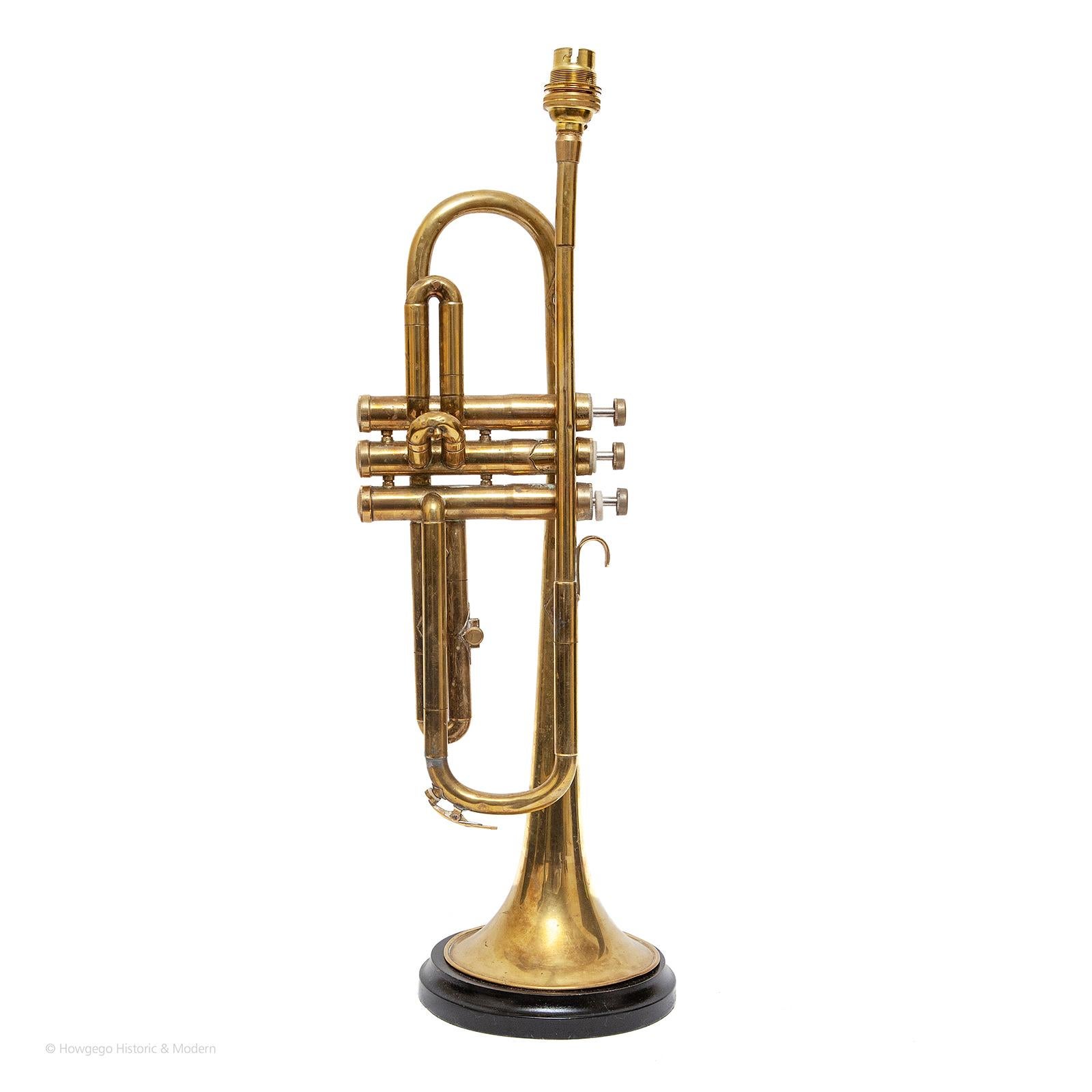 Vintage trumpet table lamp, 22” high
A fun piece of signature and conversation mood lighting

Elegant and sleek.
The trumpet is a brass wind instrument commonly used in classical and jazz 
Pricing £1,500 

Measures: Height 56cm., 22 inches