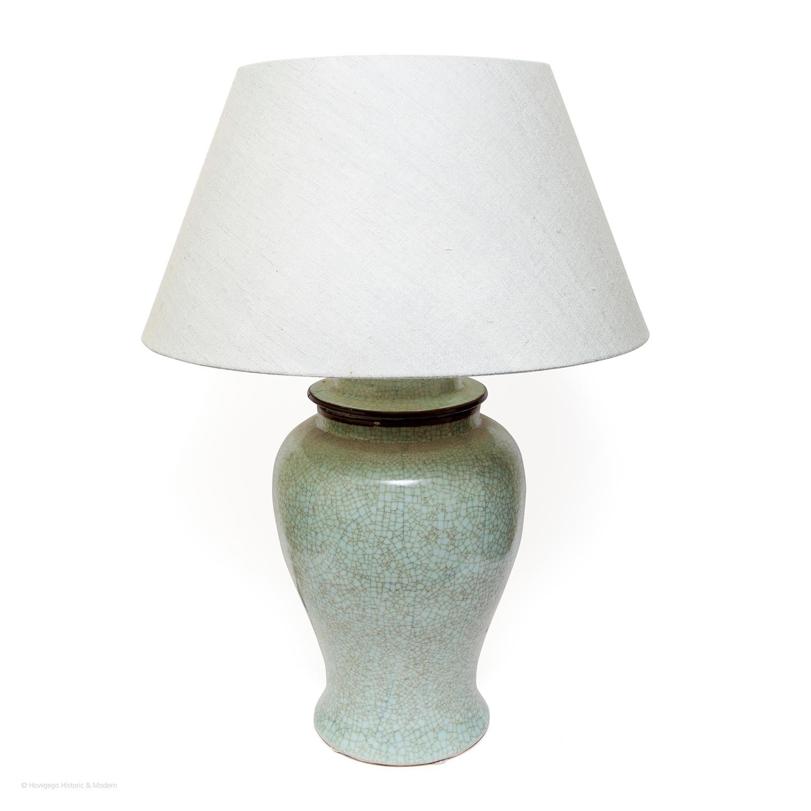 Large, vintage, Chinese, Celadon vase with cover, upcycled into table lamp with custom made linen shade, 32” high

Celadon ware has been prized for centuries for its beauty because it resembles jade
The vase has a soft undulating form.

Pale