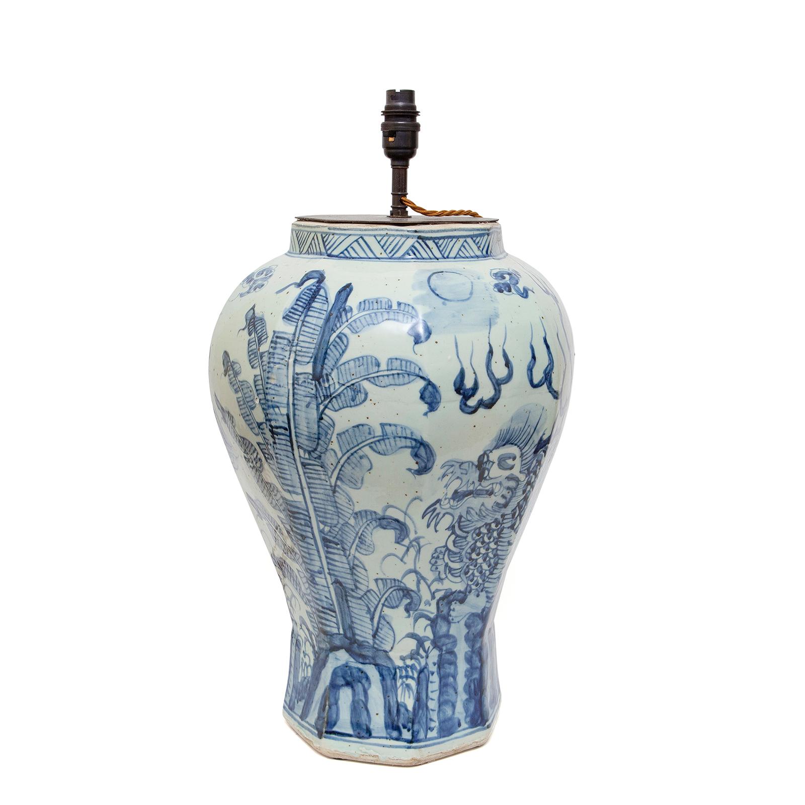 A vintage Chinese blue and white porcelain vase upcycled into a table lamp. Rocky foreground and the front with a large dragon and the back with a large stylized leafy spray with drifting clouds above.
Measurements:
Height to top of the vase -