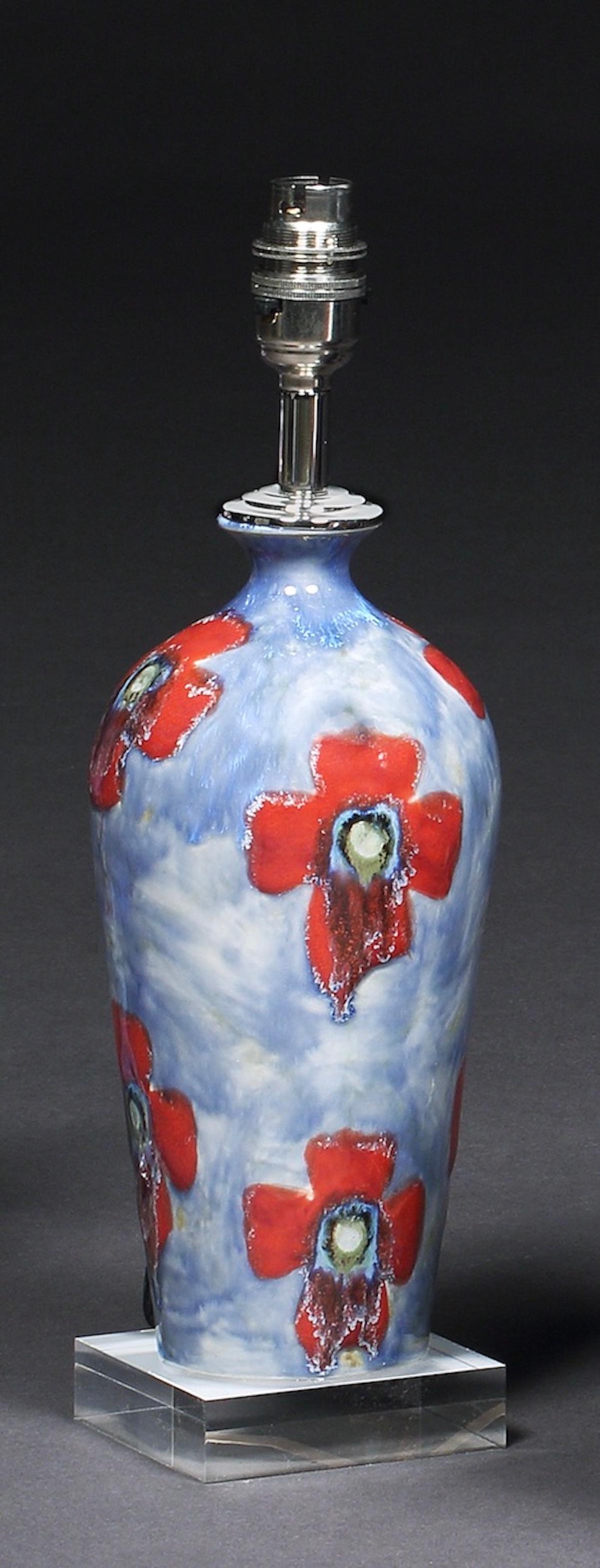 A Cobridge, poppy and ice pattern, hand painted vase converted into table lamp on perspex base, 9½” high
One of Cobridge Pottery’s most popular patterns, designed by artist Anita Harris, leading designer at Cobridge, Moorcroft & her own studio