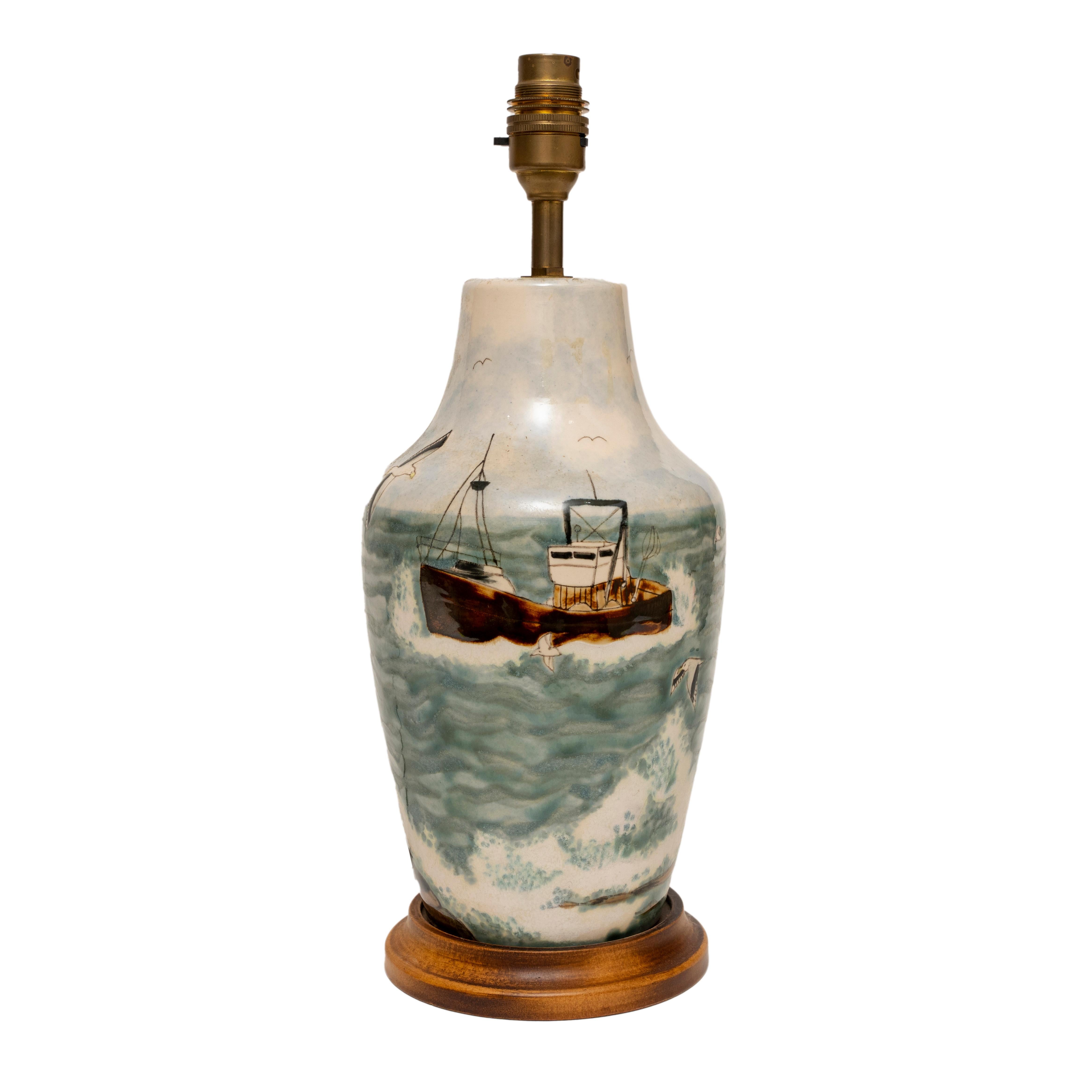 COBRIDGE STONEWARE TRAWLER AT SEA, SEAGULLS, ROCK TABLE LAMP, 37cm., 14½” high
Captures the atmosphere of a trawler returning to port accompanied by seagulls 
Of interest to the maritime or seaside enthusiast or Cobridge collectors
Realistically