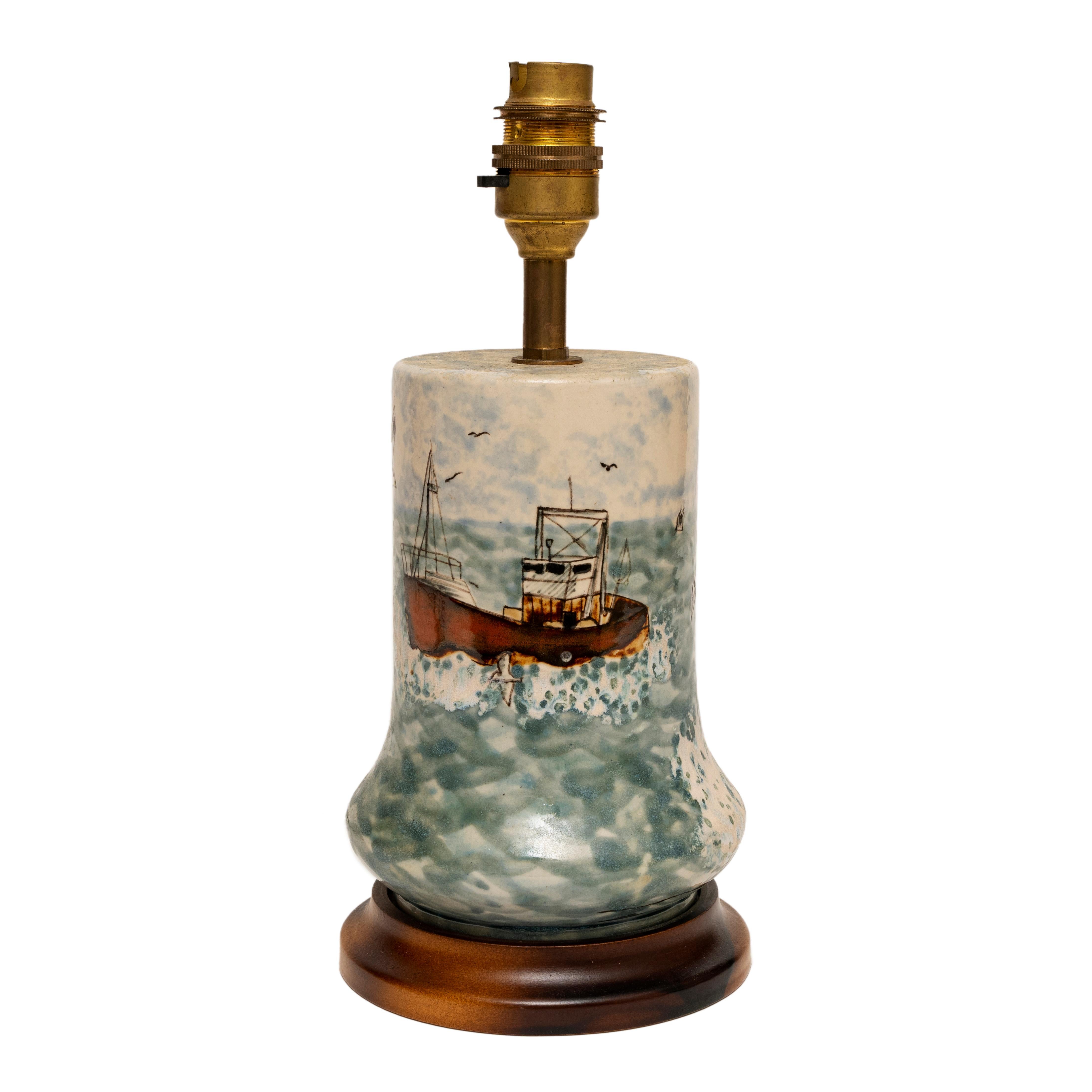 Cobridge stoneware trawler at sea, seagulls, rock table lamp, 27cm, 10¾” high
Captures the atmosphere of a trawler returning to port accompanied by seagulls 
Of interest to the maritime or seaside enthusiast or Cobridge collectors
Realistically