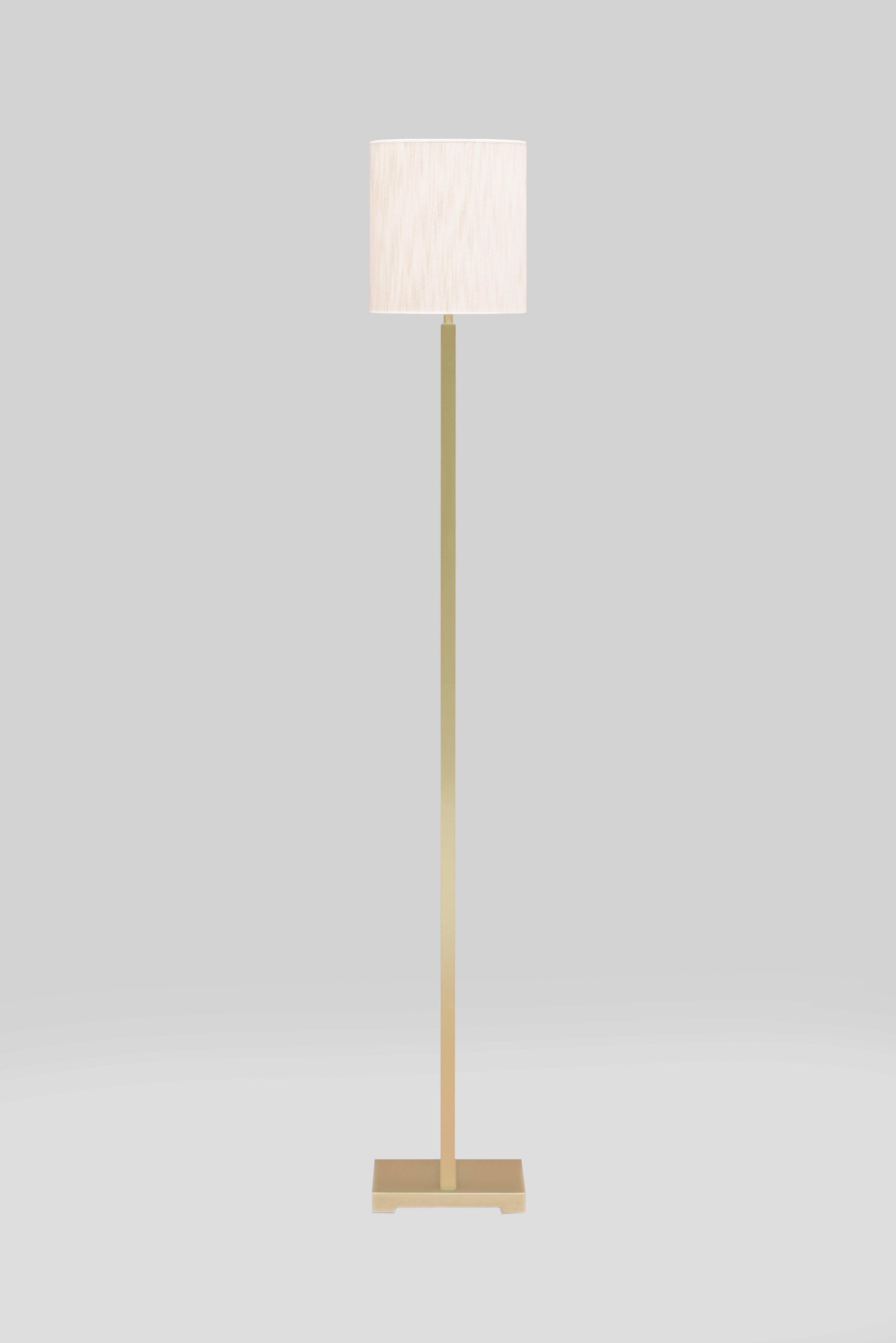 This 21st century modern Lotis MW24 floor lamp was designed by Peter Ghyczy in 2010 and hand-crafted in the GHYCZY atelier in the South of the Netherlands, with a select group of artisans. The floor lamp features a rose tinted oval shaped fabric