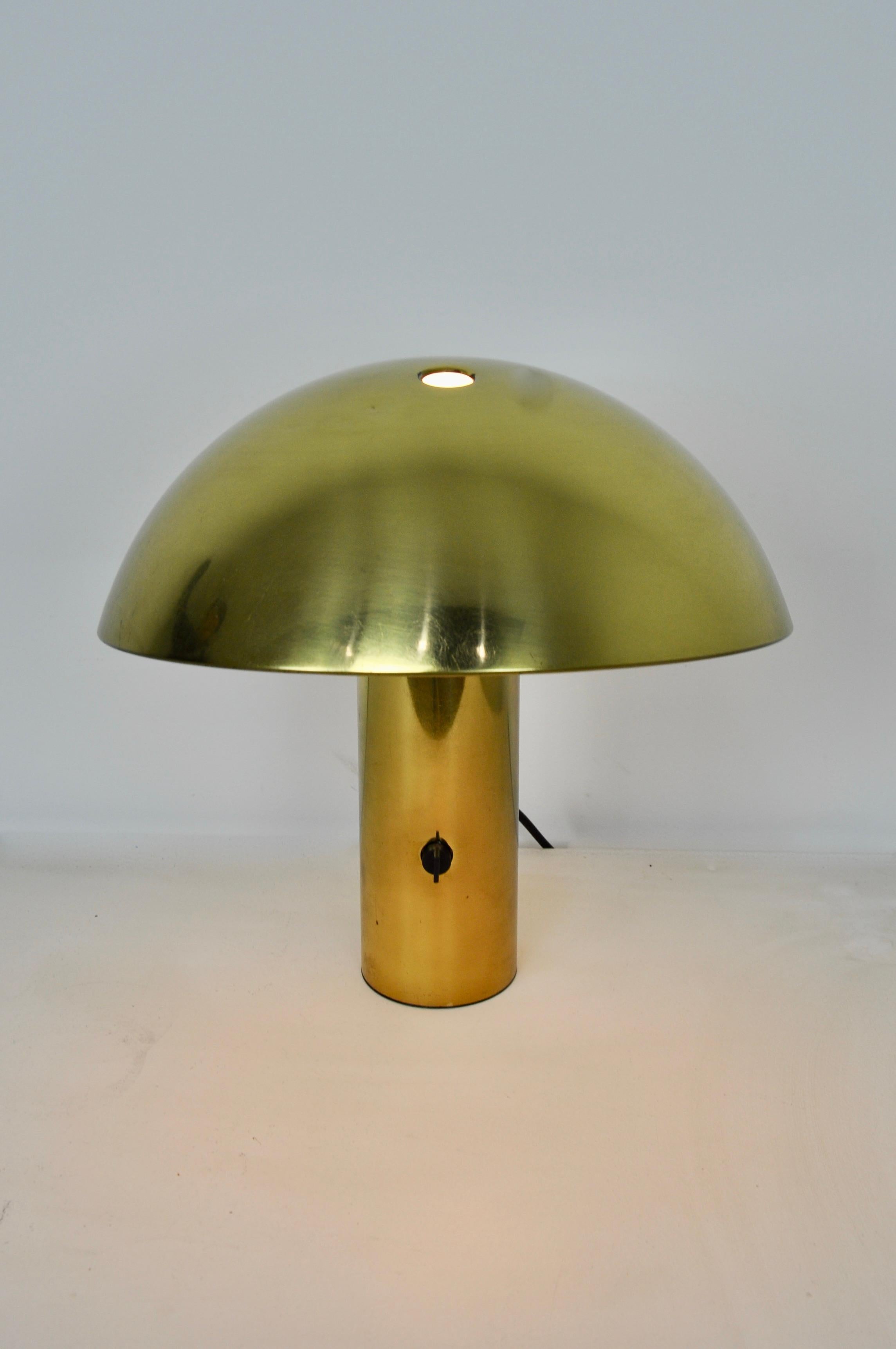 Gold color lamp. Wear due to time and age of the lamp.
 