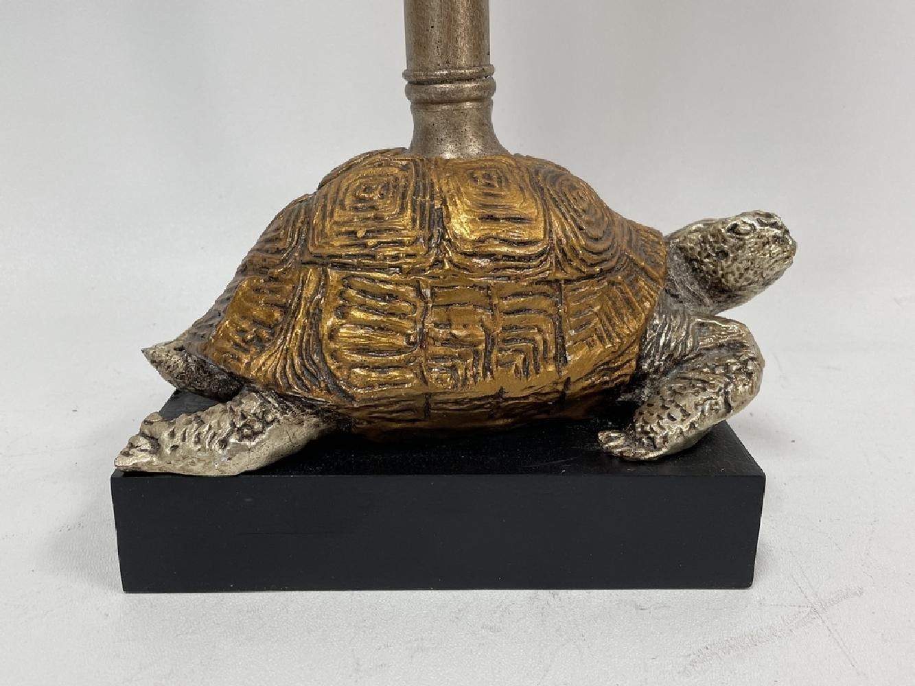 Anonymous, in the manner of Maitland-Smith
20th century; USA
Brass, marble

Approximate size: 25 x 8 x 5 in.

This distinctive Hollywood Regency style lamp, featuring a silver and gold patinated brass tortoise base and bamboo stem, is surmounted by