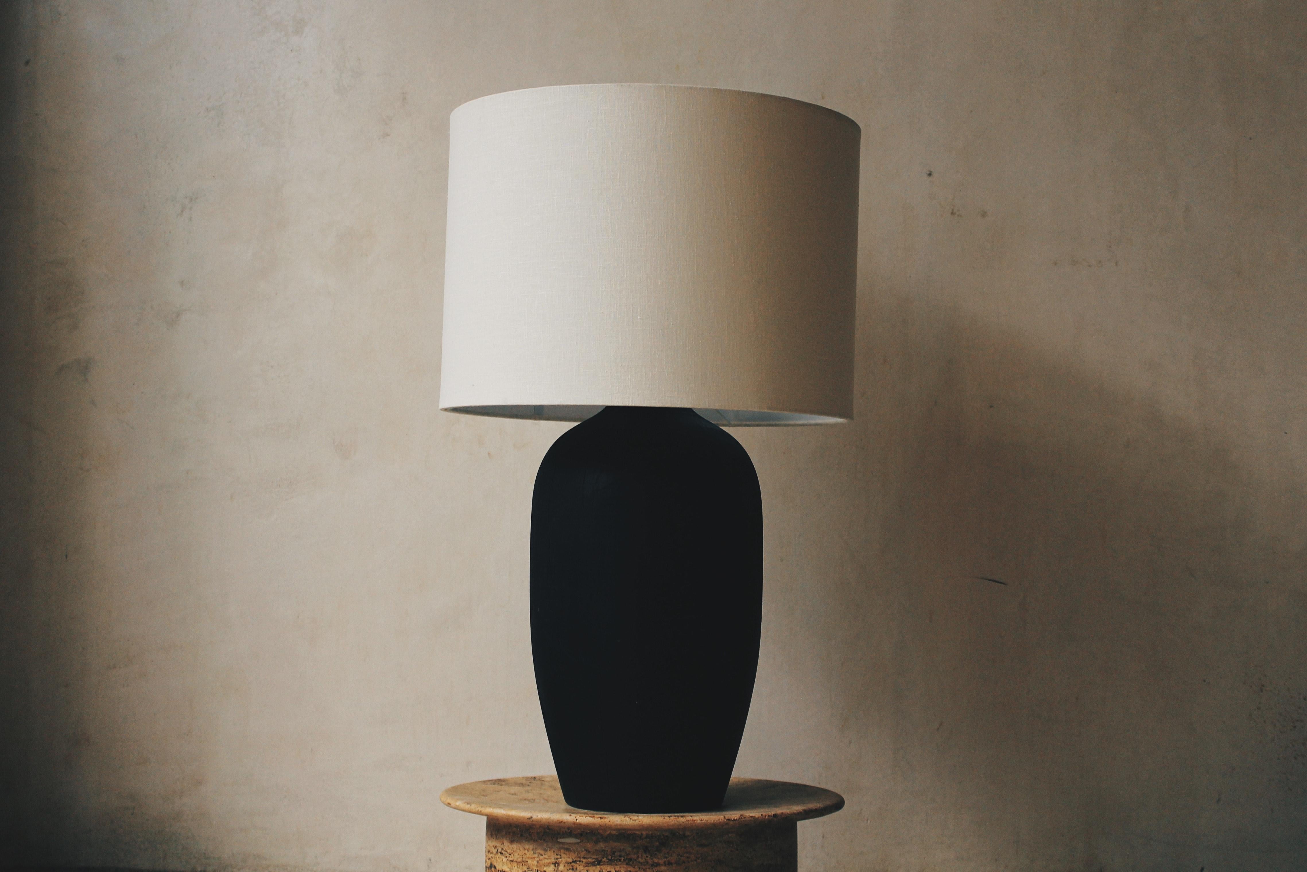 Lamp with wooden base burned and Linen shade by Daniel Orozco
Dimensions: D 18 x H 57 cm
Materials: Wood, linen

All our lamps can be wired according to each country. If sold to the USA it will be wired for the USA for instance.

Daniel Orozco