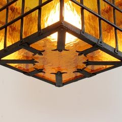 Lamp with wrought iron frame and textured amber glass diffusers - c. 1970 -