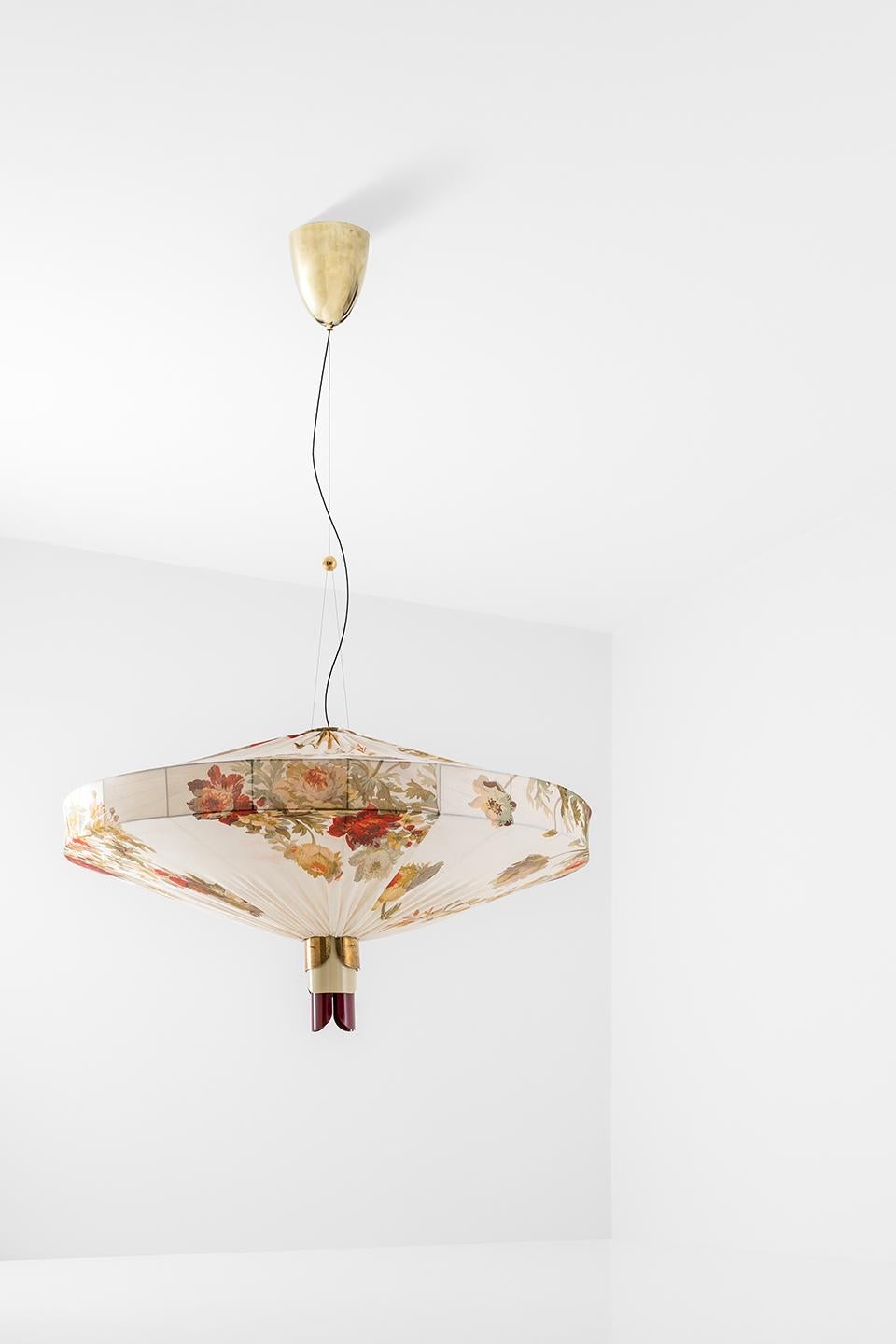 Ceiling lamp in natural brass covered with printed silk. Decorative details in brass and painted metal.
Ribbed glass internal lampshade.
Progetto Non Finito collection from Dimoremilano, by designer Dimorestudio.
Code: Lampada109 
22% VAT WILL BE