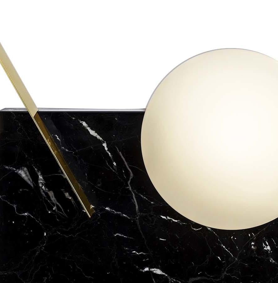 A testament to visual balance and simplicity, this light sculpture is a sophisticated accent to a minimalist- or contemporary-styled living room or entryway. In this lamp fixture, a hand-blown Murano glass orb is embedded in the corner of a large