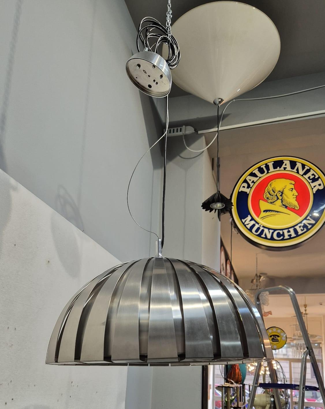 Metal chandelier produced by Elio Martinelli for Martinelli Luce. Circa 1970s. Excellent condition, working.
