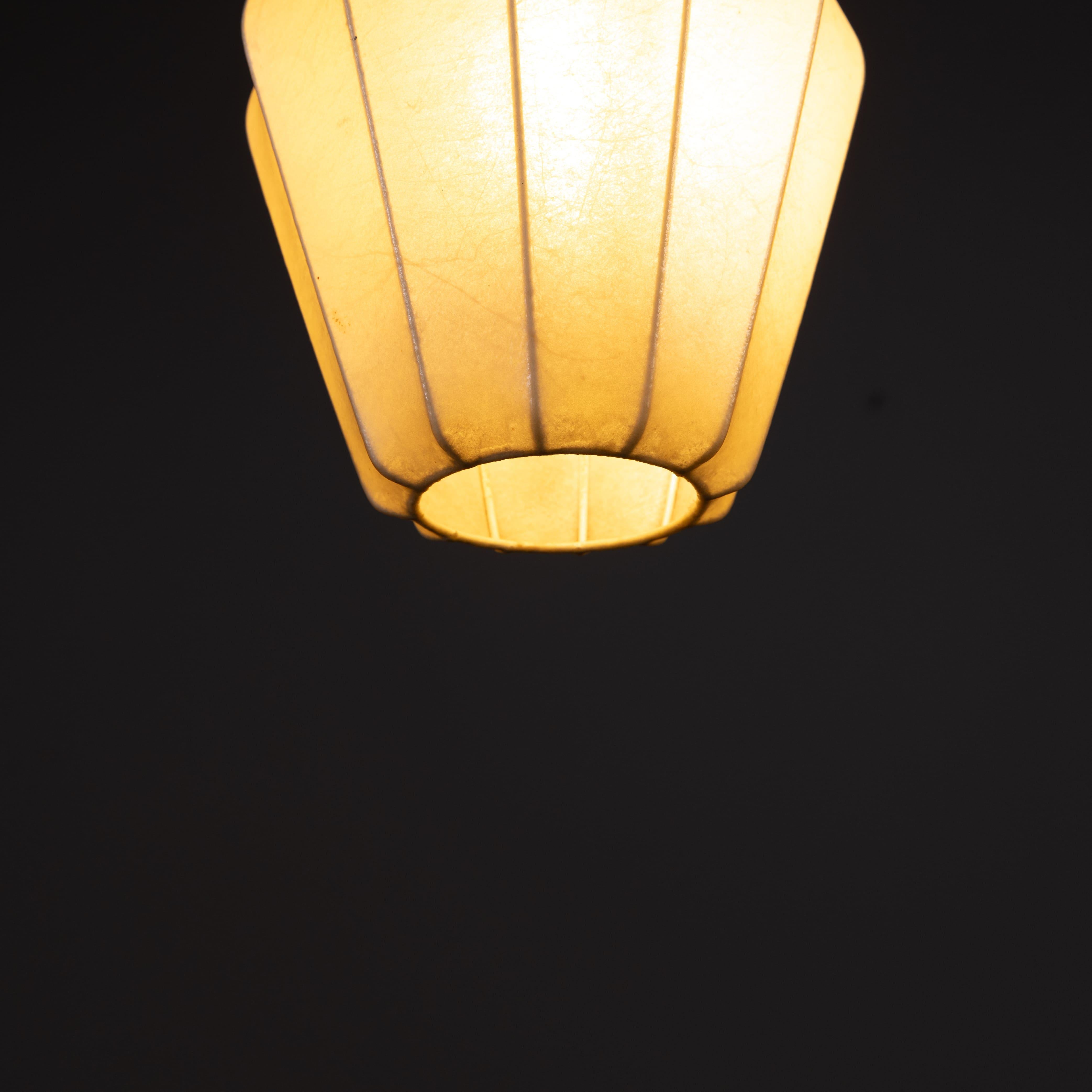 Cocoon pendant lamp, Italian manufacture, 1960s production. Cocoon and metal frame. Provenance: private home. Shows signs of time such as patina, yellowing and dark spots