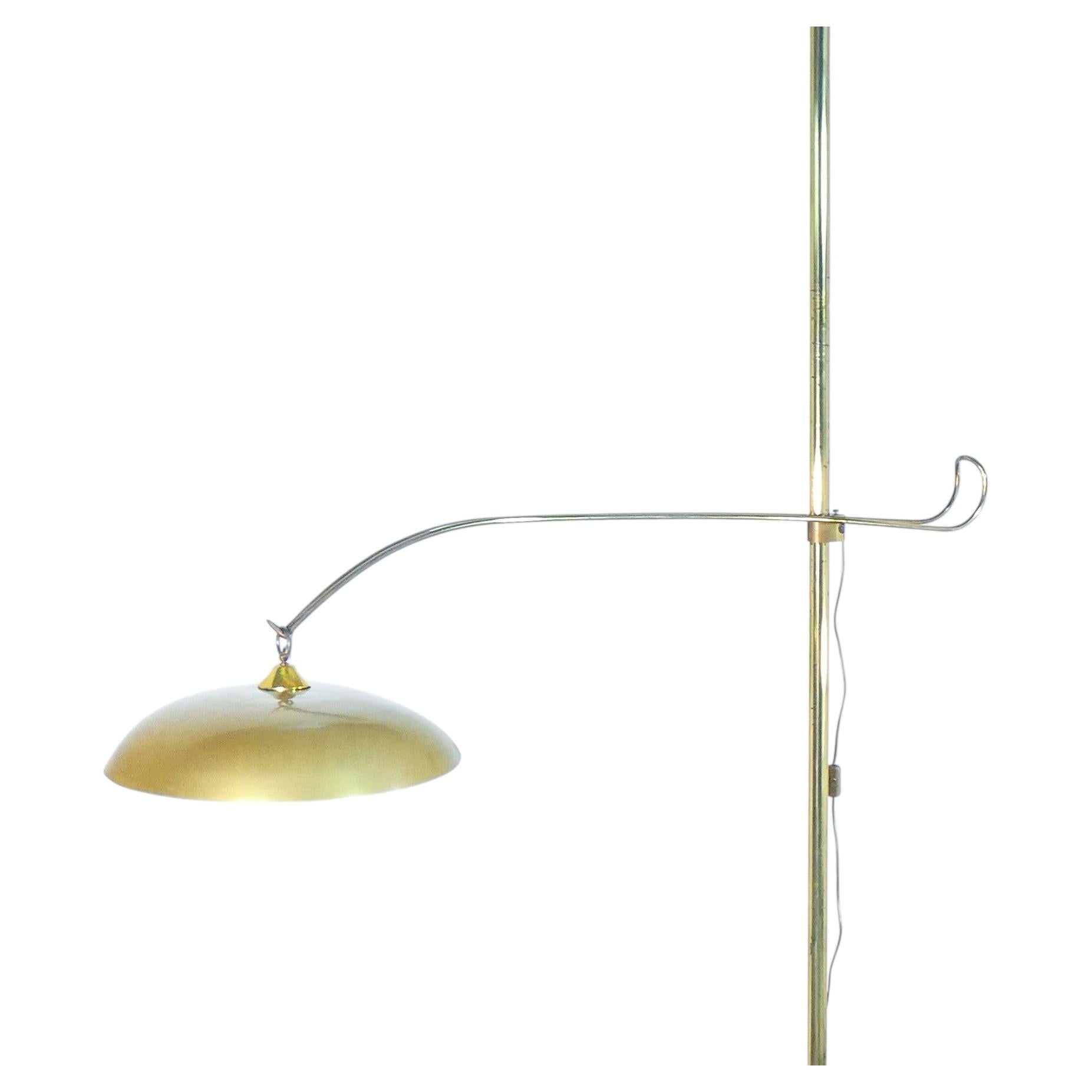 Lamp with an adjustable arm mounted on a floor-to-ceiling pole. Italian Design of the 1940s For Sale