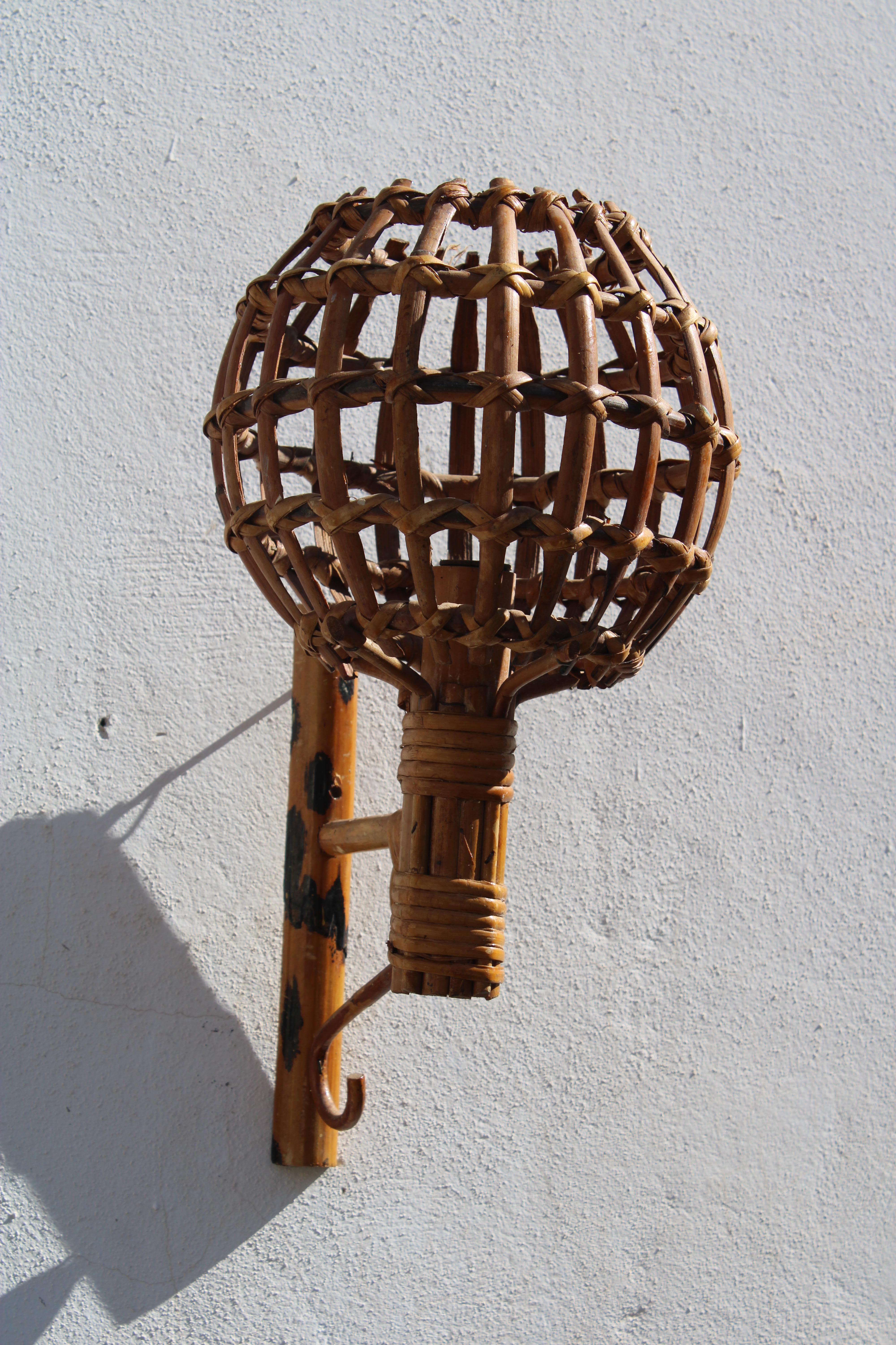 Italias 1950 handcrafted woven bamboo wall sconce.