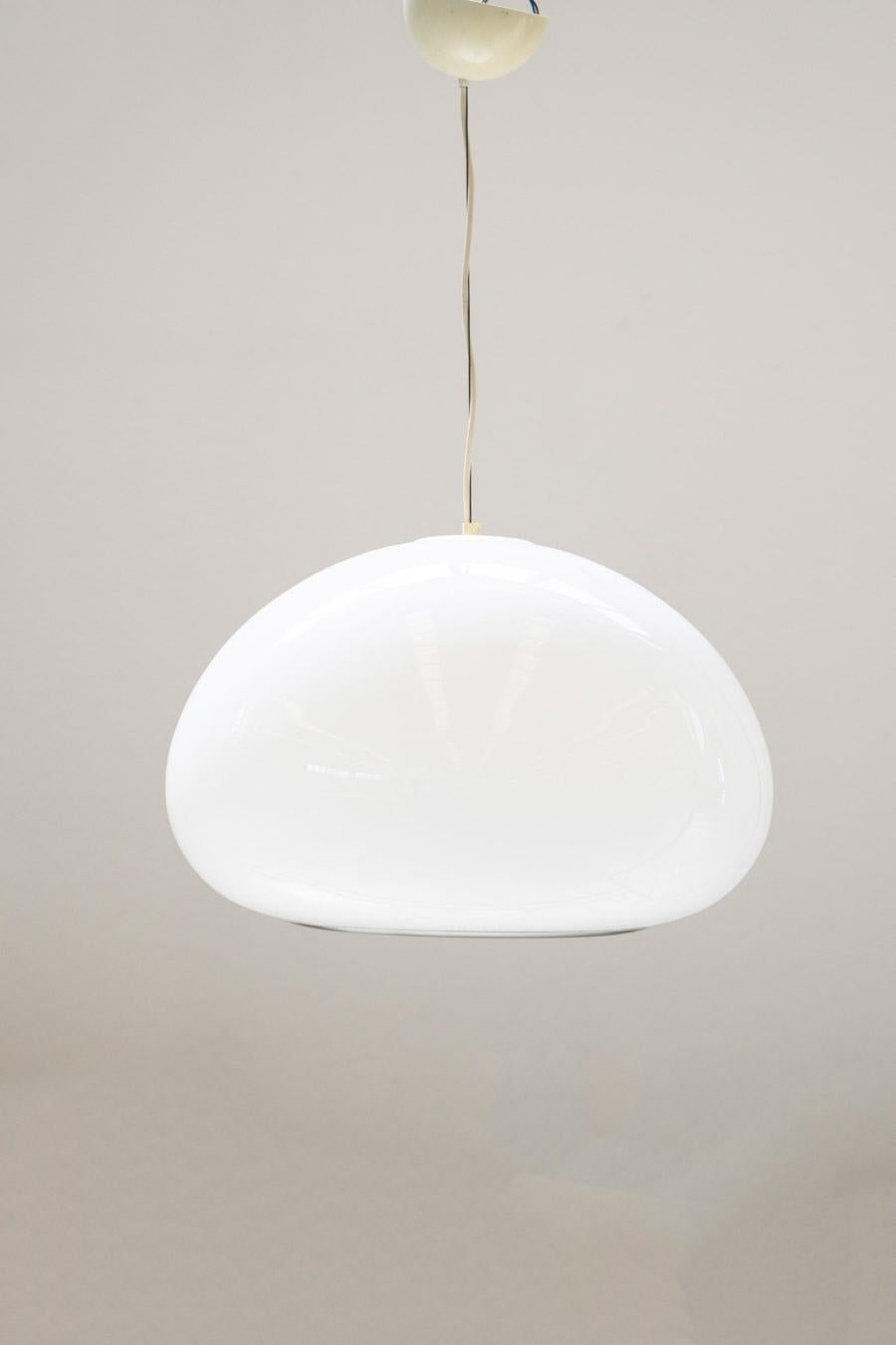TITLE Black and white ceiling lamp  by Pier James and Achilles 					Castiglioni for Flos, 1965			
DESCRIPTION Made of white opal glass with lighting under and inside the glass. 	Designed by Pier Giacomo and Achille Castiglioni for