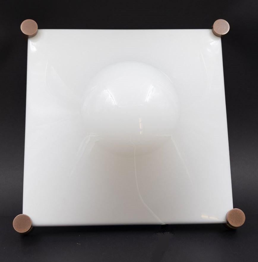 Stunning original edition of ceiling light Bolla, an icon of 1970s Space Age design produced by Martinelli Luce.
Being one of the earliest editions, the original brass and ceramic lamp holder was retained, changing only the wires by putting modern