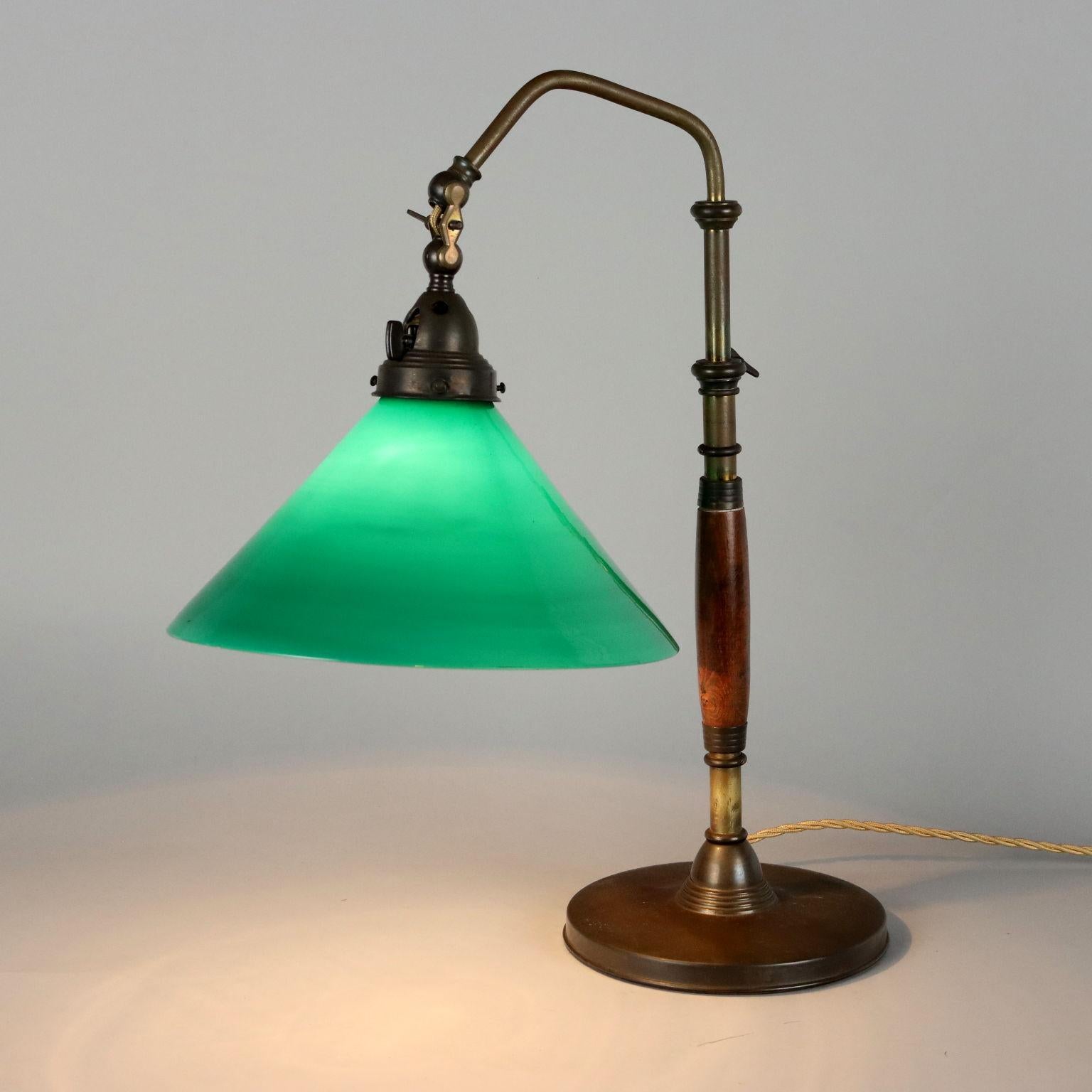 Table lamp with adjustable shade, brass, wood, glass. 