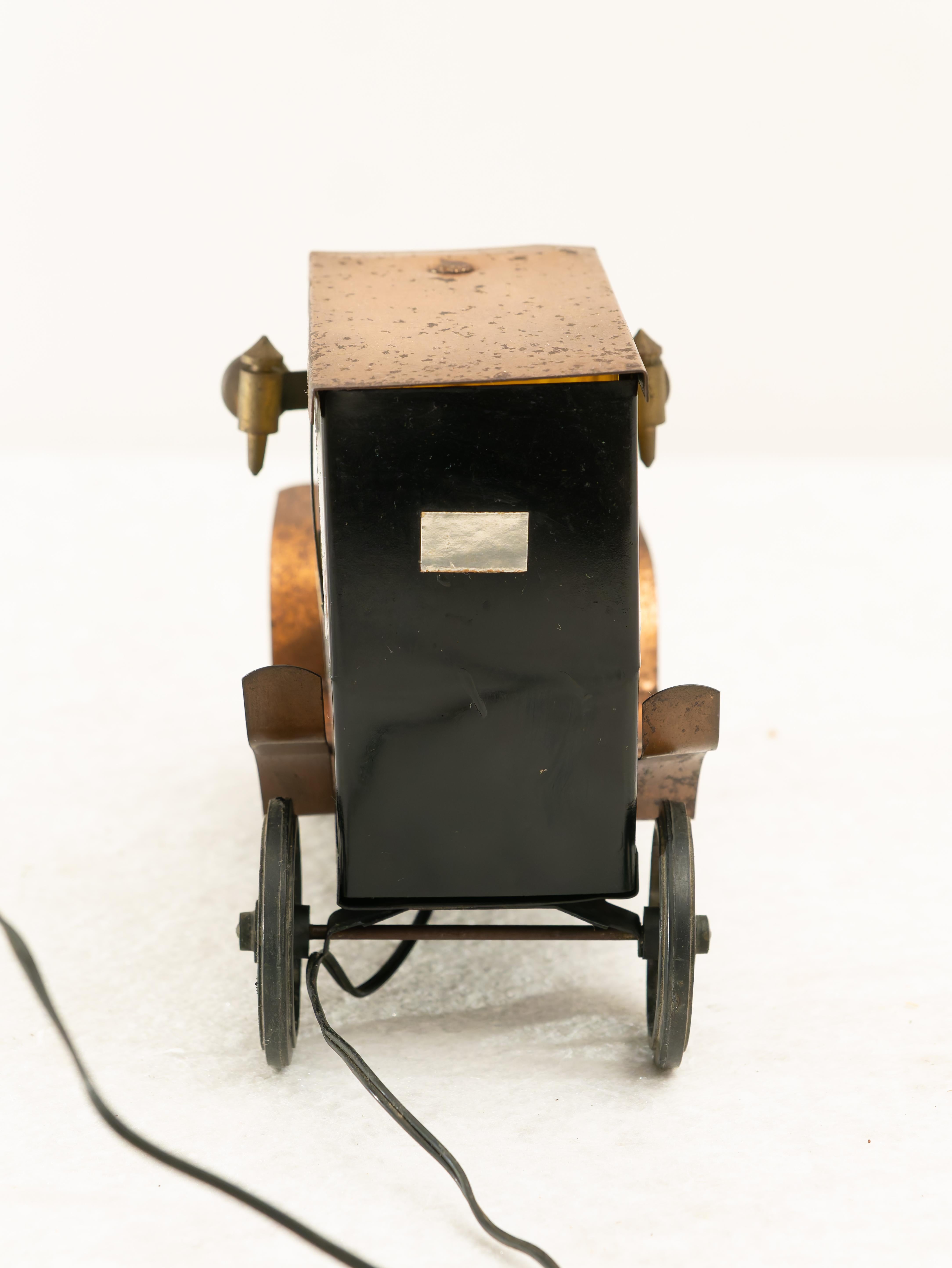 Table lamp, Made in Italy, 1950s. 
Pretty metal table lamp in the shape of an antique car, very special and beautiful piece of design. It is functional; the system has been rewired.Condition is excellent, may show slight signs of time due to age and