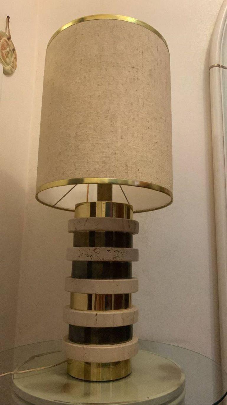 Table lamp for minimalist projects, exhibitions and more, we go beyond the aesthetic aspect because the signs of wear and tear nicely resume the original.
Product: travertine and brass table lamp with silk shade by Giuliano Cesari for