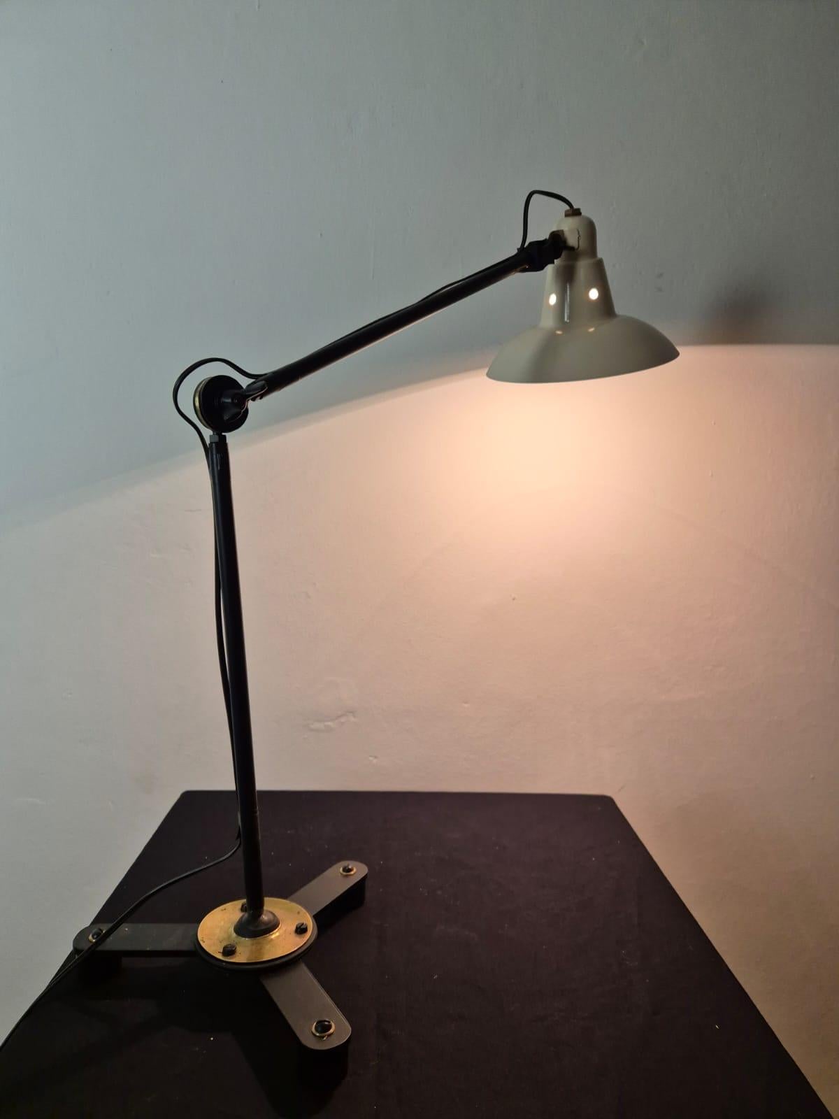 Adjustable industrial lamp,desk lamp made of iron brass and painted aluminum, completely restored in both electrical system and painting.
Rare and custom-created model for important desks.
excellent lamp for those who want a functional and elegant