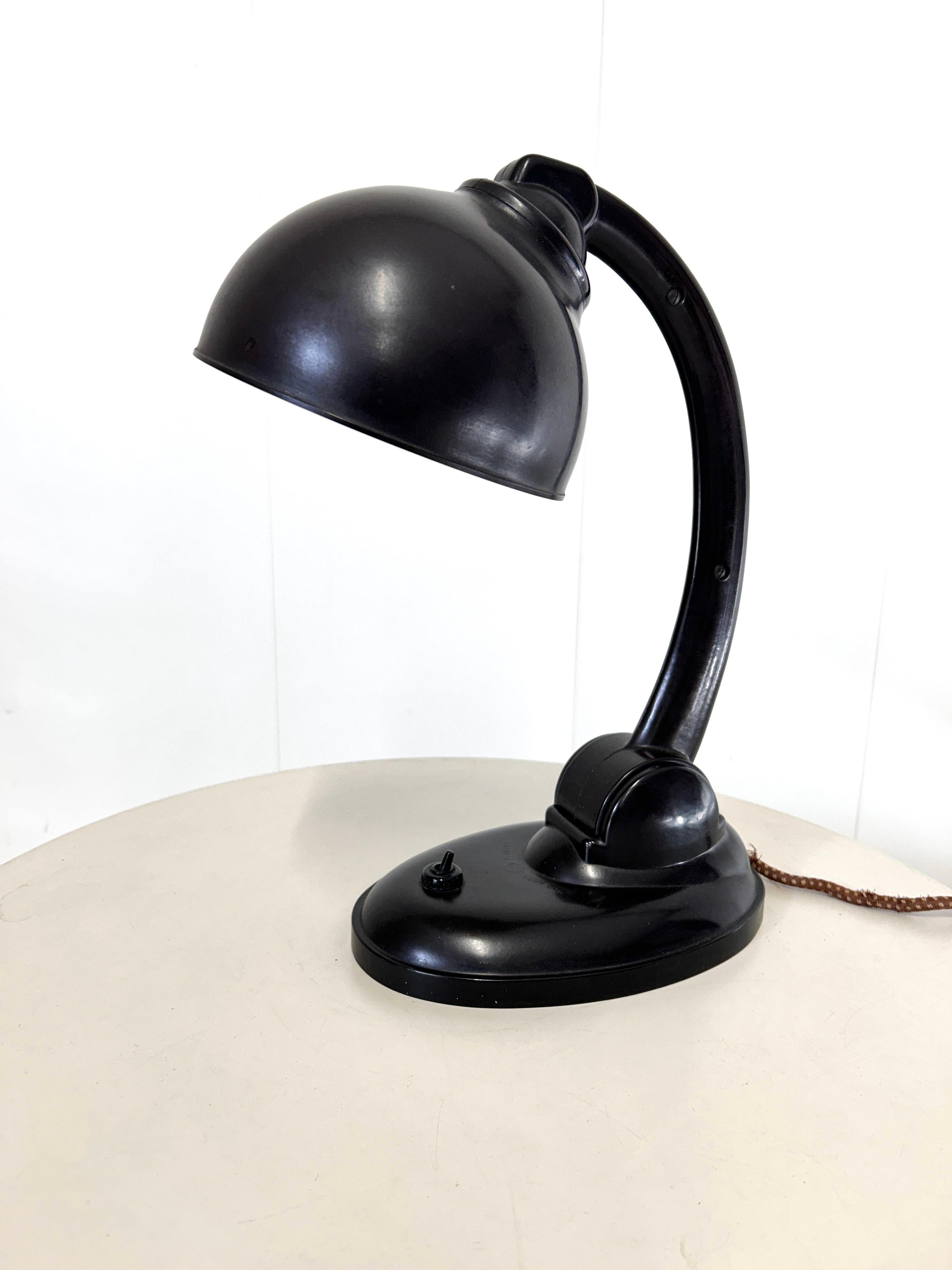 This modernist table lamp was designed in Britain in the 1930s by Eric Kirkham Cole. Cole was the founder and chief designer of the British electronics company EKCO, which specialized in the production of radios and, later, televisions using new