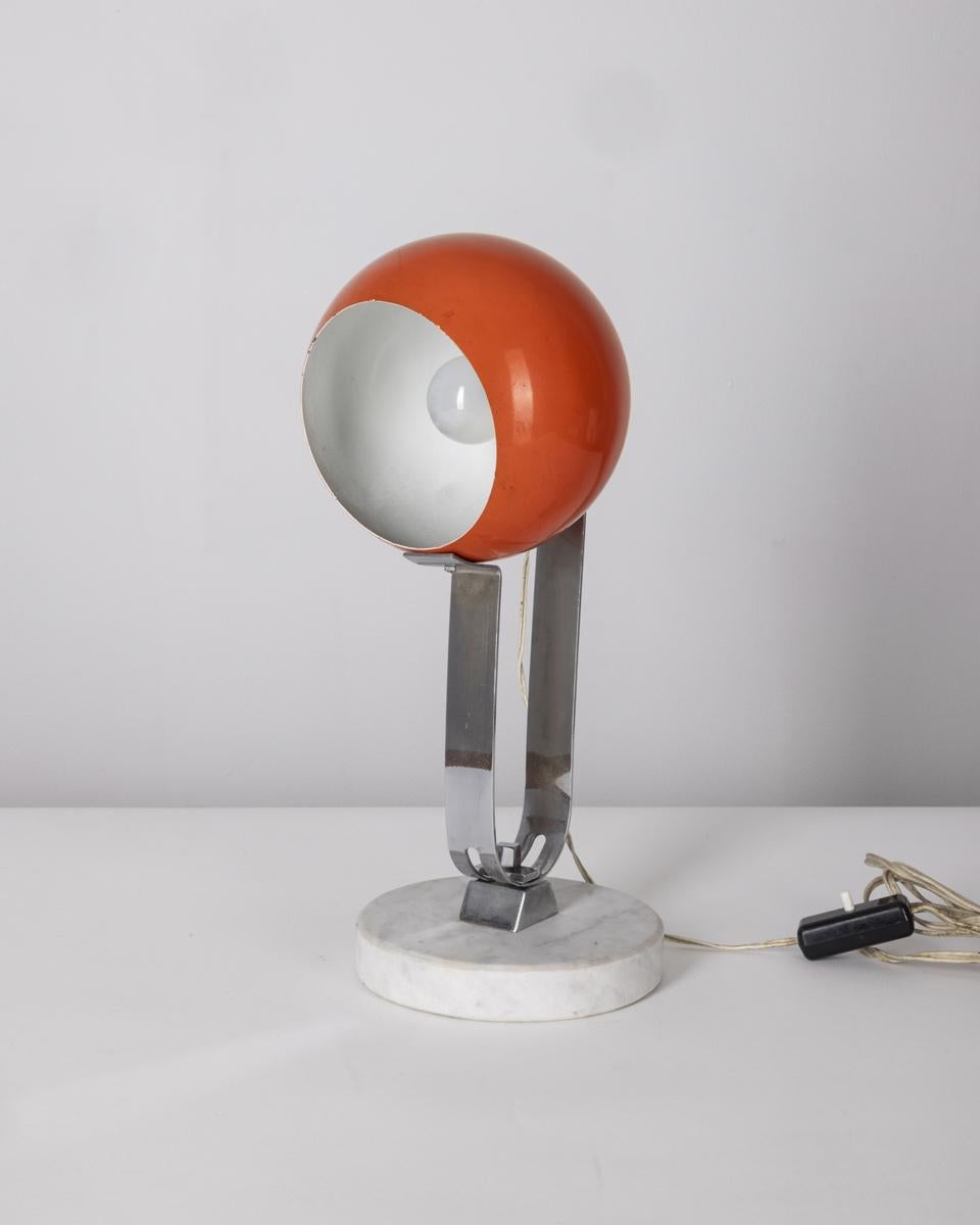 Table lamp with marble base, chrome metal body and orange shade, adjustable, Italian design, 1960s.

CONDITION: In good, working condition, may show slight signs of wear given by time.

DIMENSIONS: Height 38 cm; Diameter 15 cm

MATERIAL: Marble and