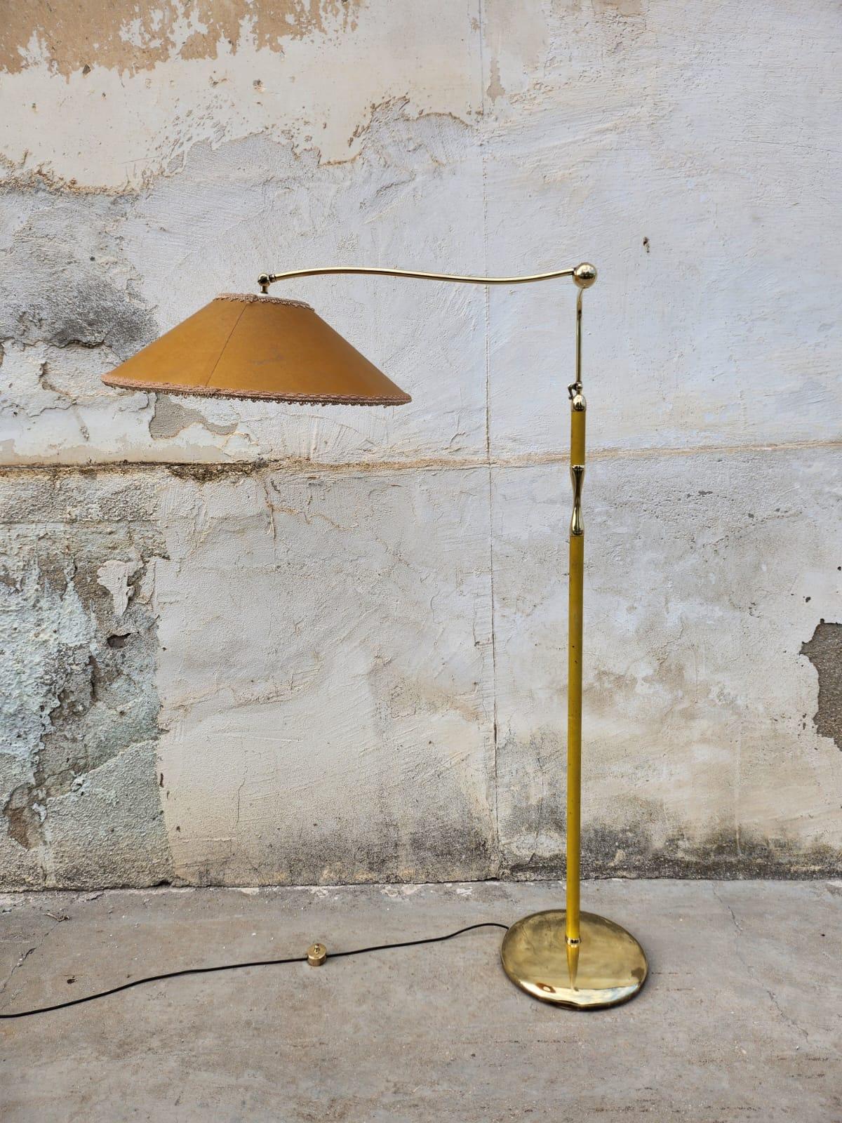 Gorgeous Bridge 12246 floor lamp by Angelo Lelii for Arredoluce. The floor lamp is adjustable in height from 150 cm to 190 cm maximum height. Brass foot-operated ignition switch 
As per the attached photos , it is part of the Arredoluce catalog ,