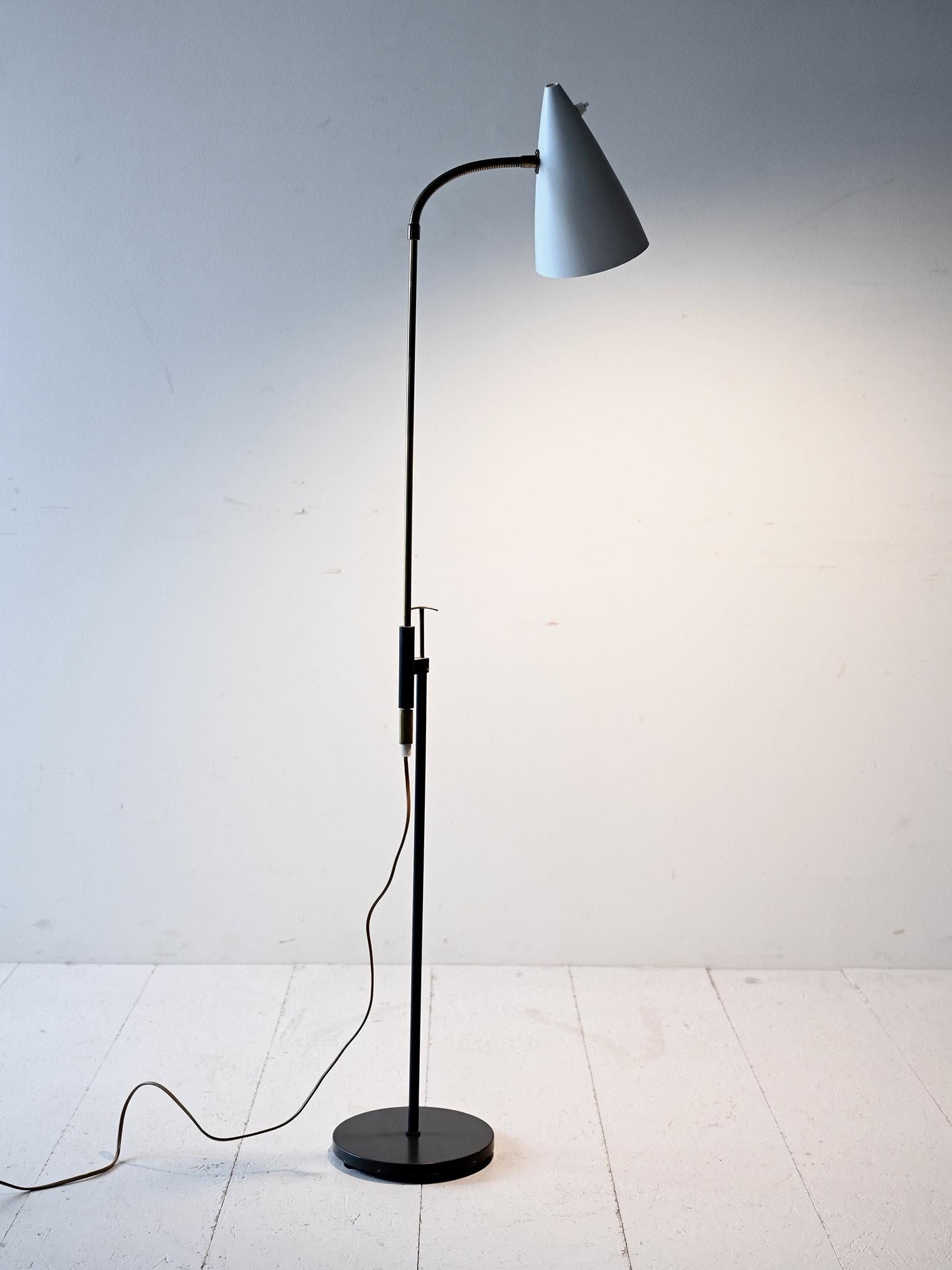 Scandinavian adjustable metal and brass lamp, made by Falkenbergs Belysning, 1960s. Functional and straightforward design.

Vintage floor lamp from the 1960s, manufactured by Falkenbergs Belysning in Sweden. Made of black painted metal with brass