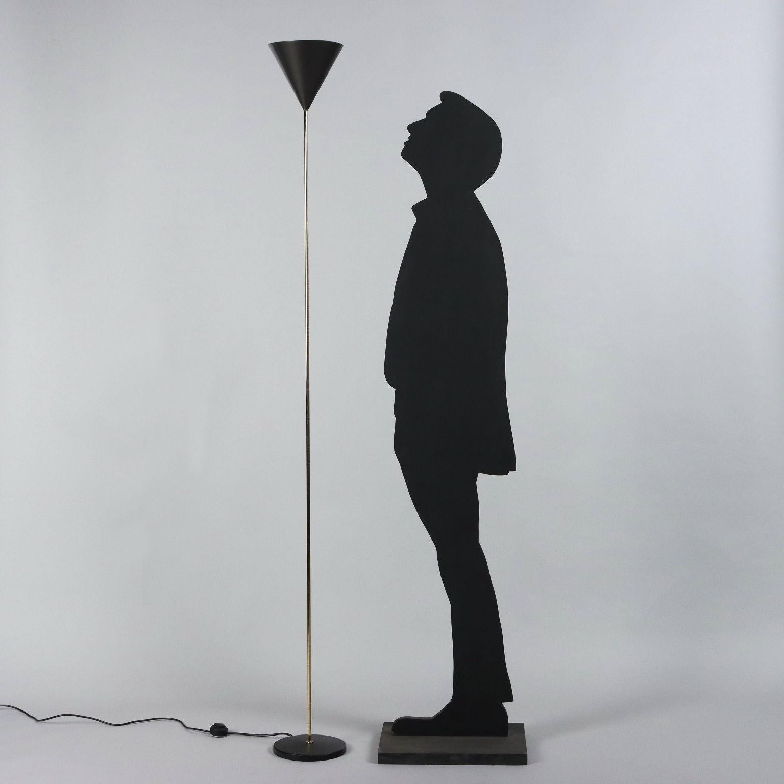 Elegant floor lamp designed by Luigi Caccia Dominione in 1954 with painted cast iron base, brass stem and lacquered aluminum shade. Good Condition