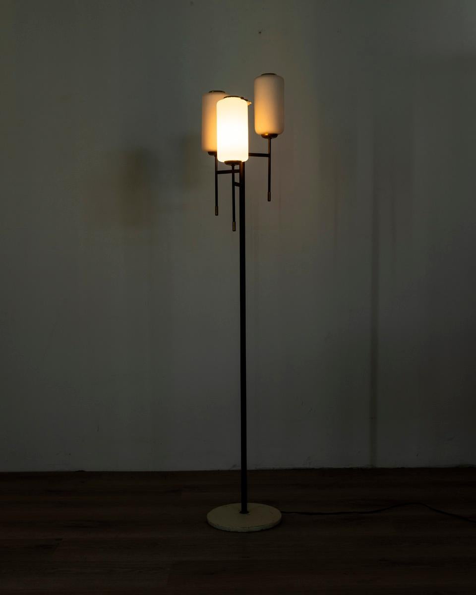 Floor lamp with white metal base and black metal body with gilt brass inserts, three lights with white glass shades, Italian design, 1950s.

CONDITION: In good condition, working, shows signs of wear given by time.

DIMENSIONS: Height 145 cm;