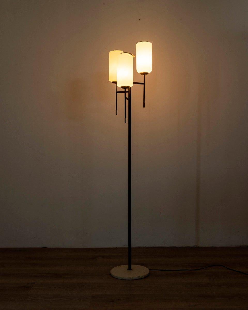 Floor lamp with white metal base and black metal body with gilt brass inserts, three lights with white glass shades, Italian design, 1950s.

CONDITION: In good condition, working, shows signs of wear given by time.

DIMENSIONS: Height 145 cm;