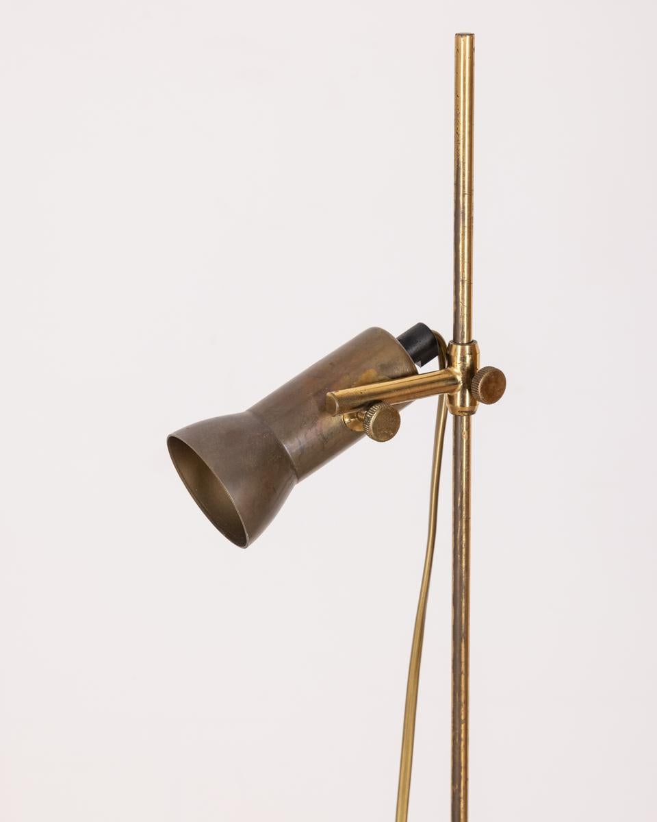 Gilt brass floor lamp with adjustable light, Italian design, 1960s.

CONDITION: In good, working condition, may show signs of wear given by time.

DIMENSIONS: Height 131 cm; Diameter 16 cm

MATERIAL: Brass and Plastic

YEAR OF PRODUCTION: Anni 60
