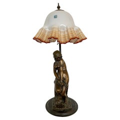 Art Nouveau 20th century bronze and murano glass figural lamp