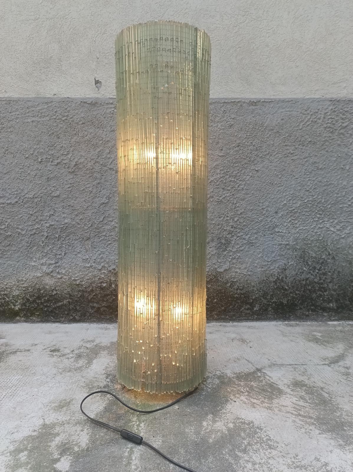 This extraordinary floor lamp from the 1970s is an elegant expression of Italian sculptural design, and is attributed to Albano Poli for Poliarte, a renowned Veronese manufacturer active between the 1960s and 1980s.
Made of blown glass with a