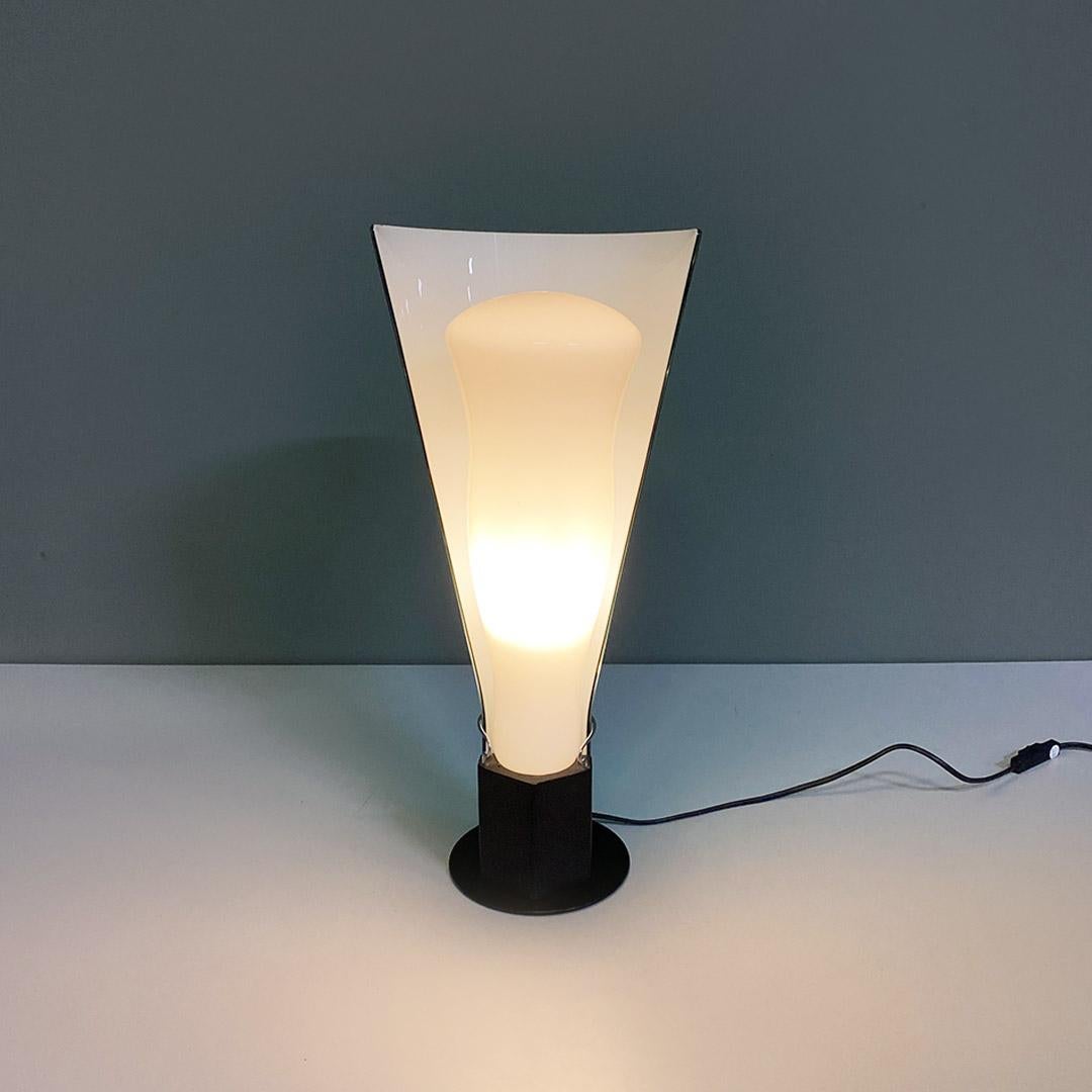 Table lamp with a structure composed of two pieces of glass, a first central opaline glass with a semi-cylindrical shape and a small hole placed at the top in the central part, and a second encapsulated glass of octanium color outside and white