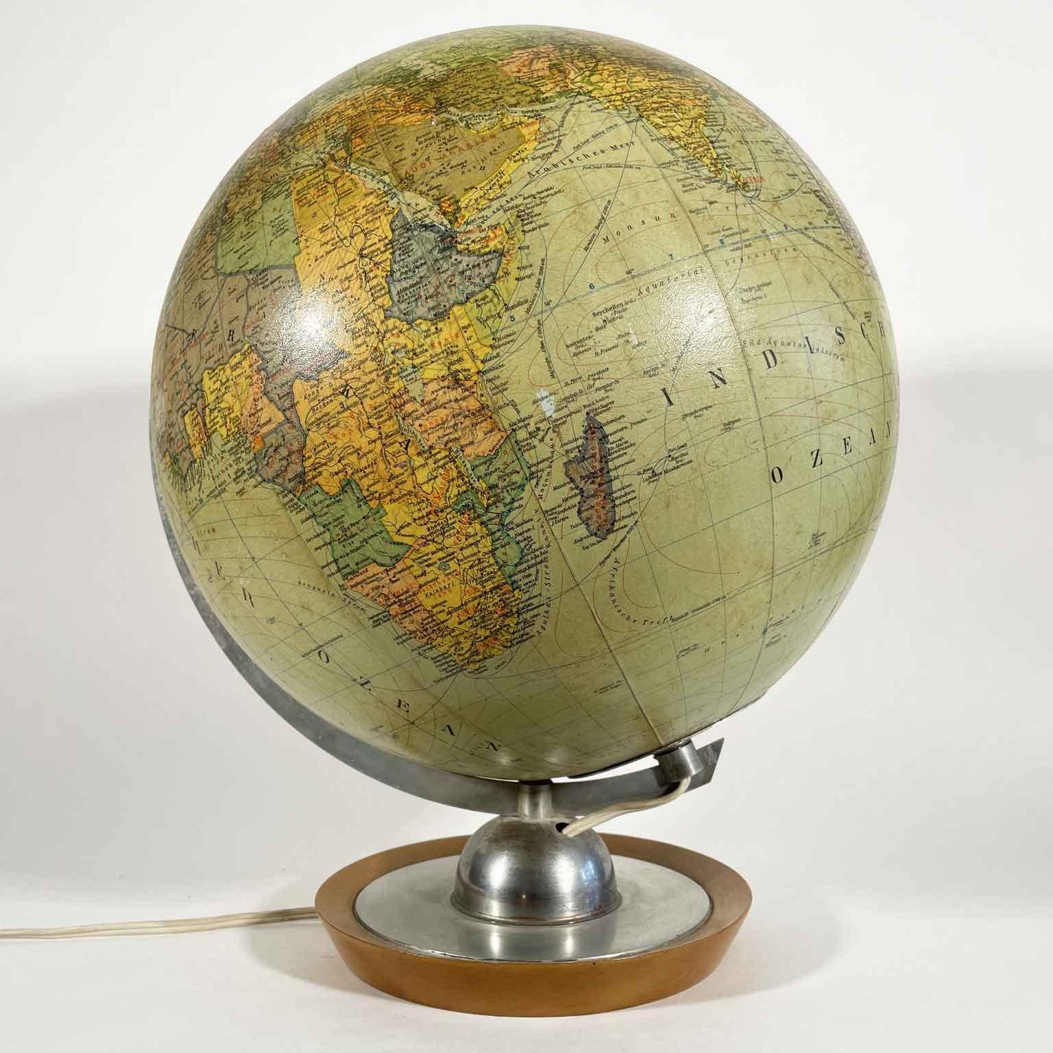 JRO Globus Globus globe lamp circa 1950 with the glass globe and  interior lighting of German origin; it is a political globe with a diameter of 33 centimenters, made by the JRO Globus company  of Monaco.  It is in German and dates back to the