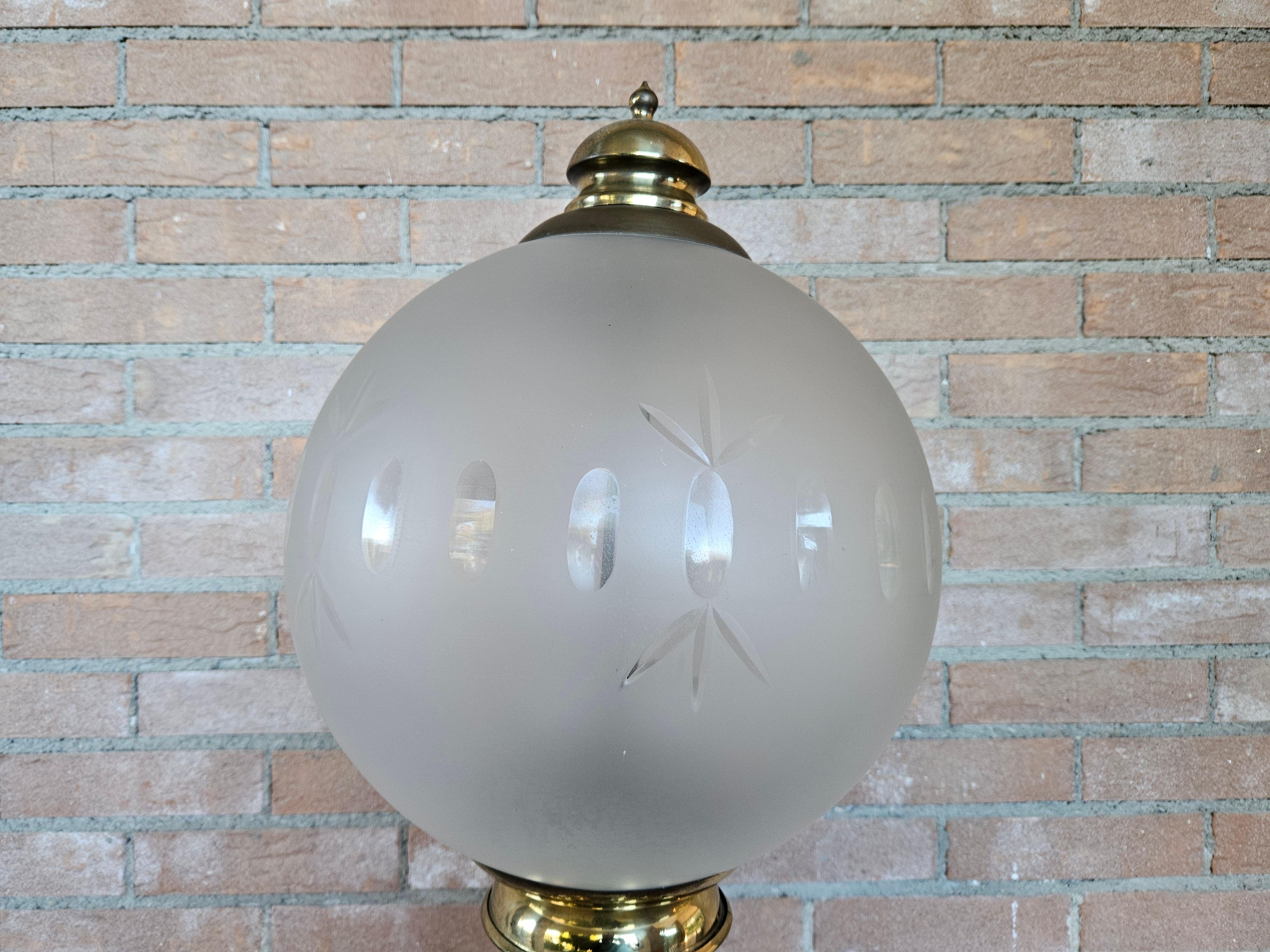 Floor lamp with frosted and decorated glass ceiling light, brass frame and circular marble base.

Italian furniture element from the early 1980s, very suitable for modern and vintage entrances or living rooms.

Shows normal signs of wear from age