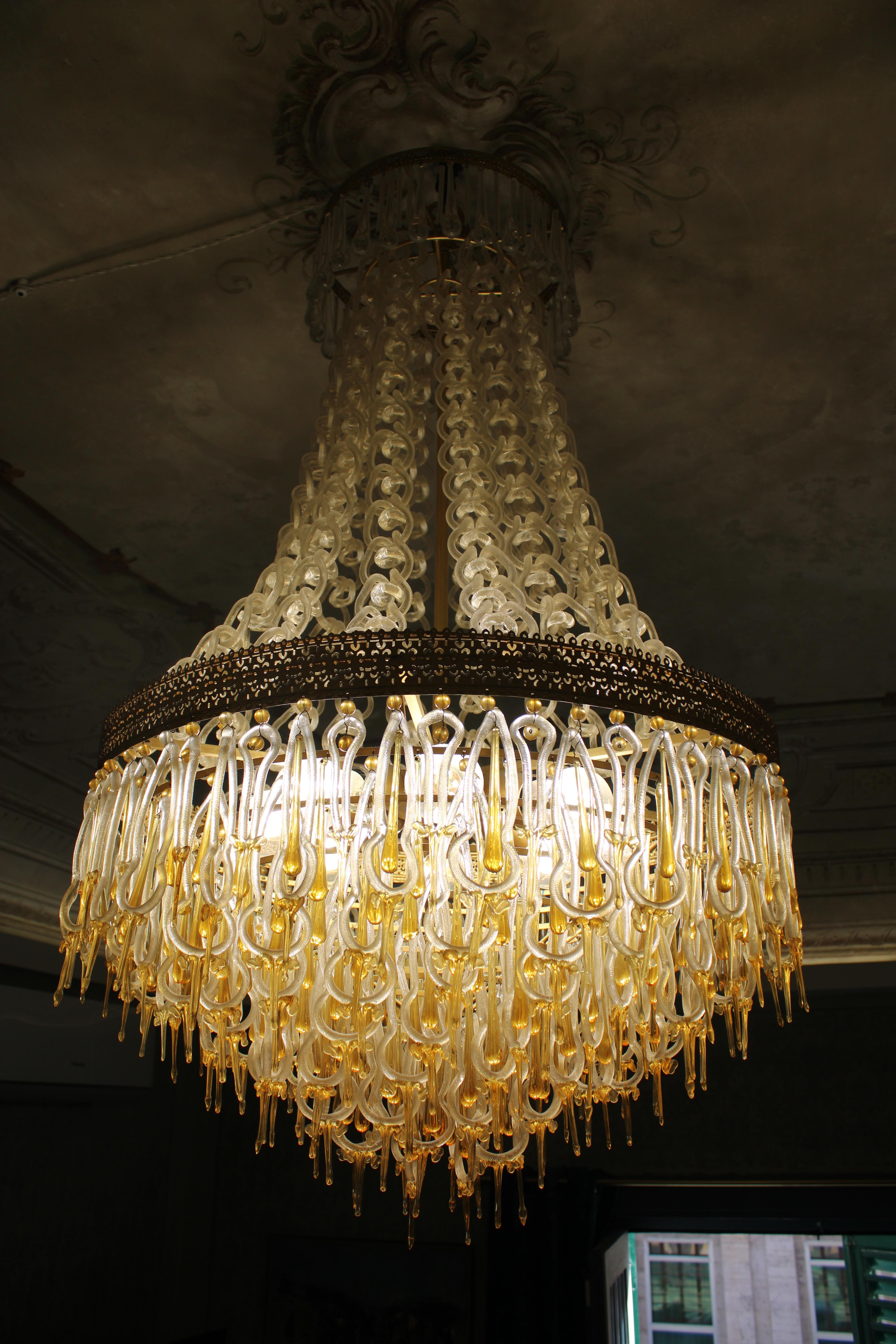 Elegant and rare Lamapdario by Archimede Seguso, with chain made of Murano glass with Gold Dust, each part is incredibly handmade , Brass frame.