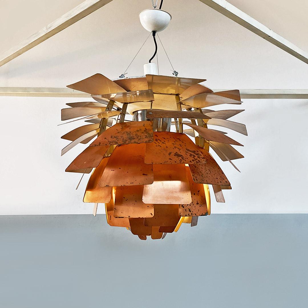 PH Artichoke model chandelier with a structure composed of curved copper slats to create its unmistakable artichoke shape. One of the most dated specimens, marked by the patina and oxidation of time, but currently fully restored. Supported at the